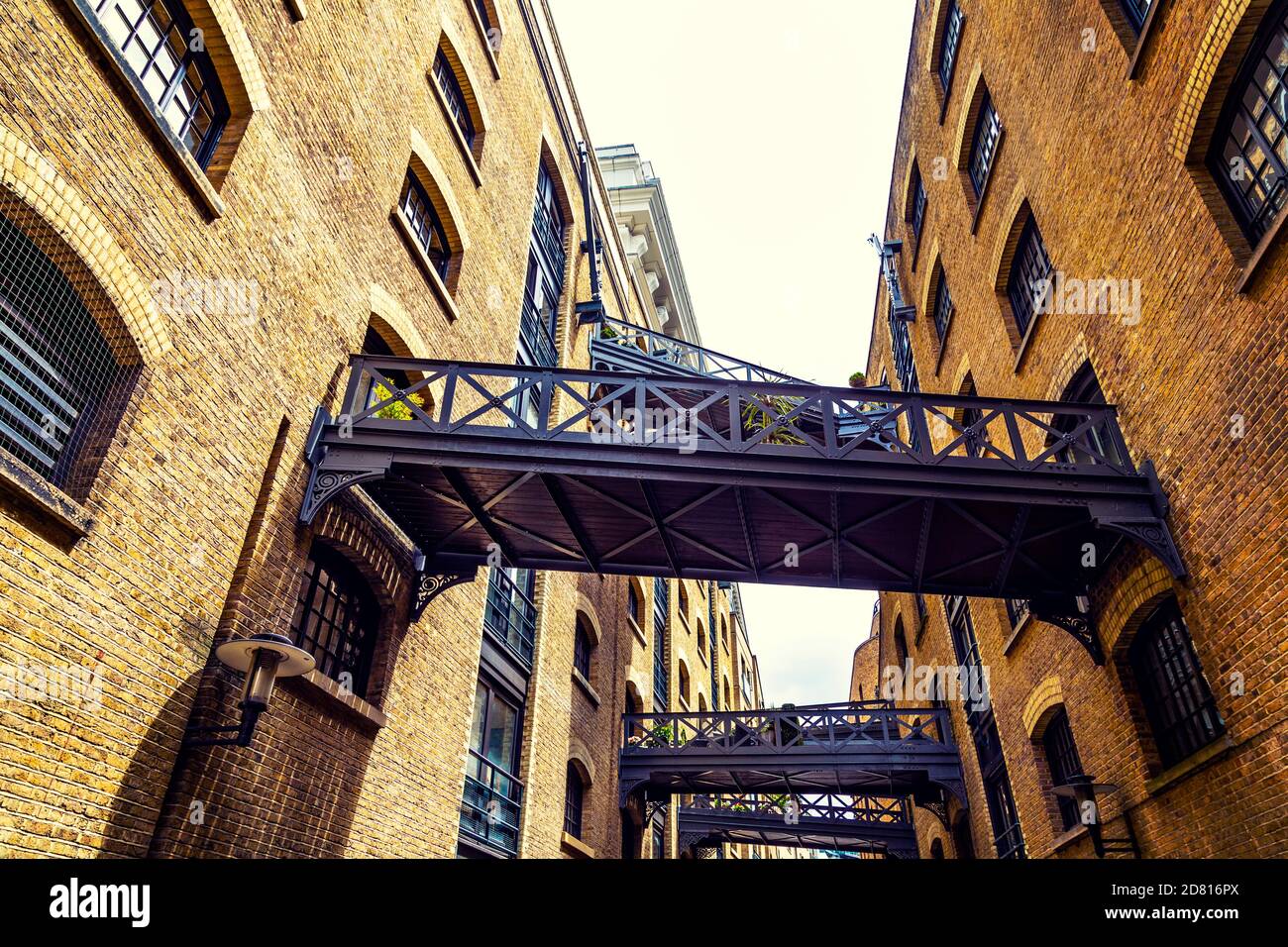 Warehouses and walkways on the historic riverside street Shad Thames, London Bridge, London, UK Stock Photo