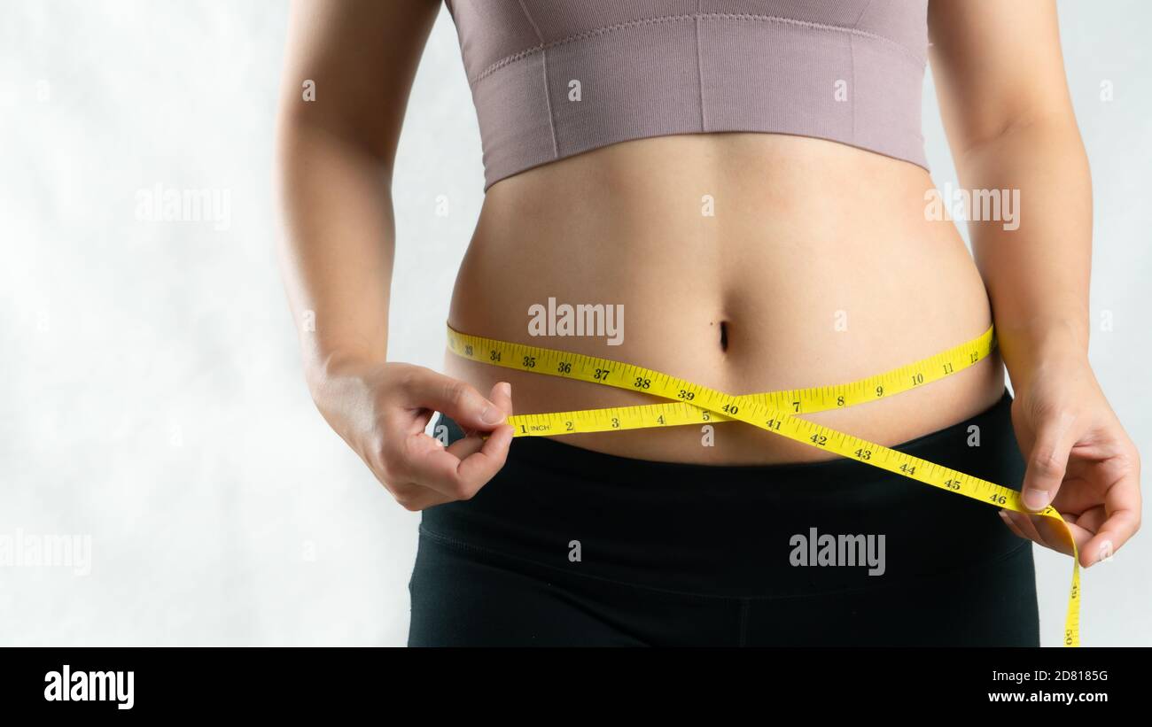 Tape measure around someone's waist – License Images – 936264