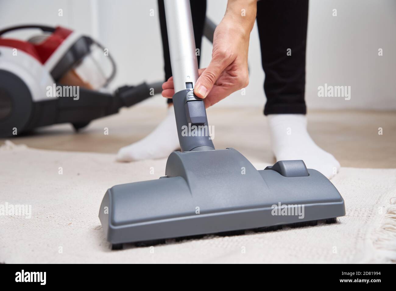 Woman using vacuum cleaner hi-res stock photography and images - Alamy