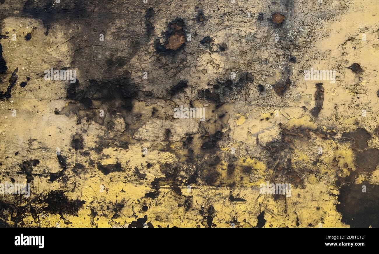 Rusty metal background with cracked yellow paint Stock Photo