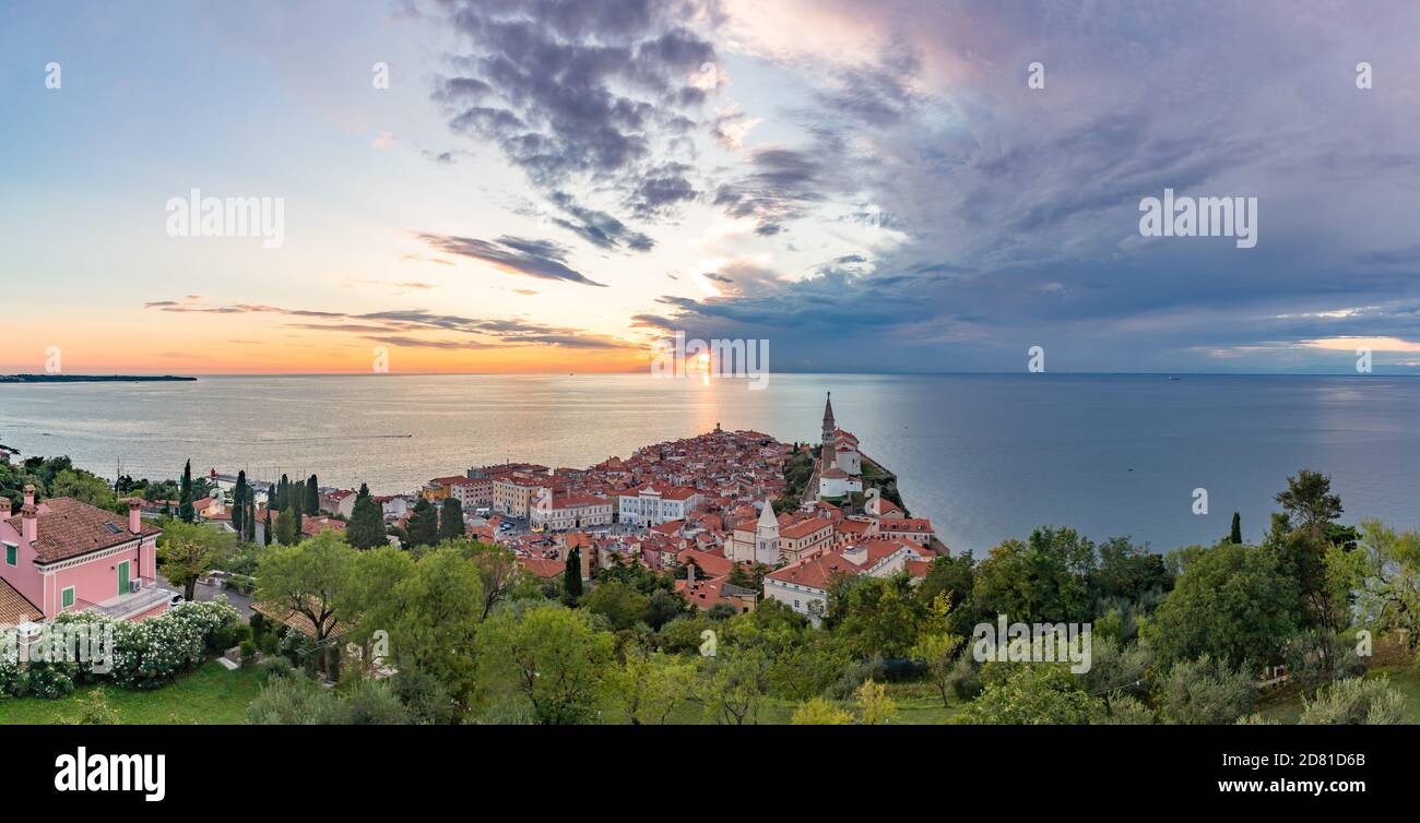 A panorama picture of the town of Piran and the Adriatic Sea captured at sunset. Stock Photo