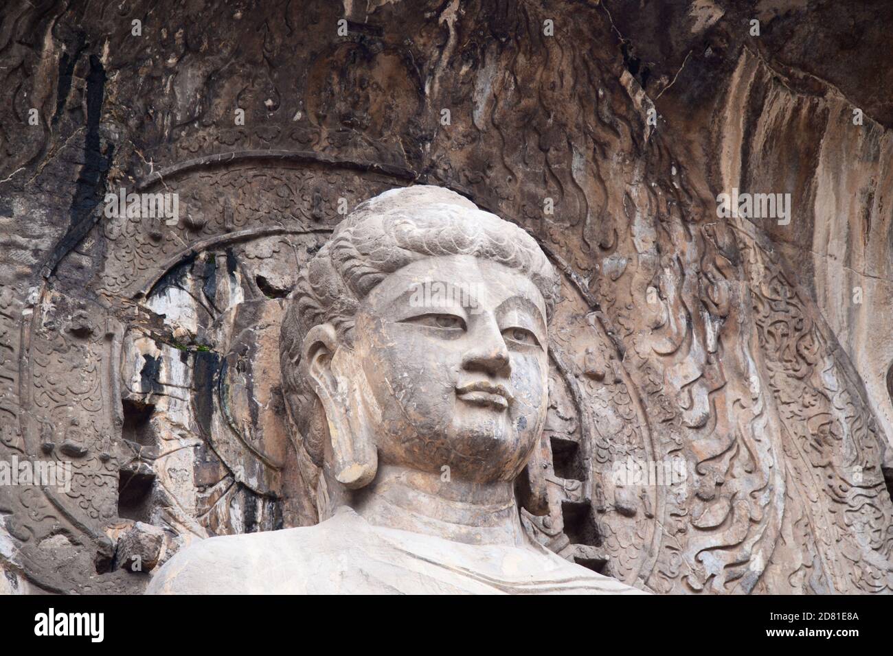 Famous Longmen Grottoes (statues of Buddha and Bodhisattvas carved in the monolith rock near Luoyang in Hennn province, China) Stock Photo