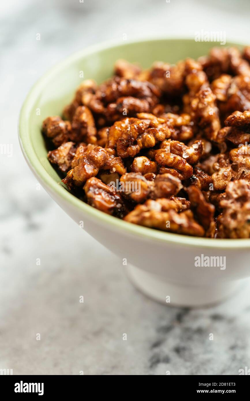 Home made spicy candied walnuts. Stock Photo