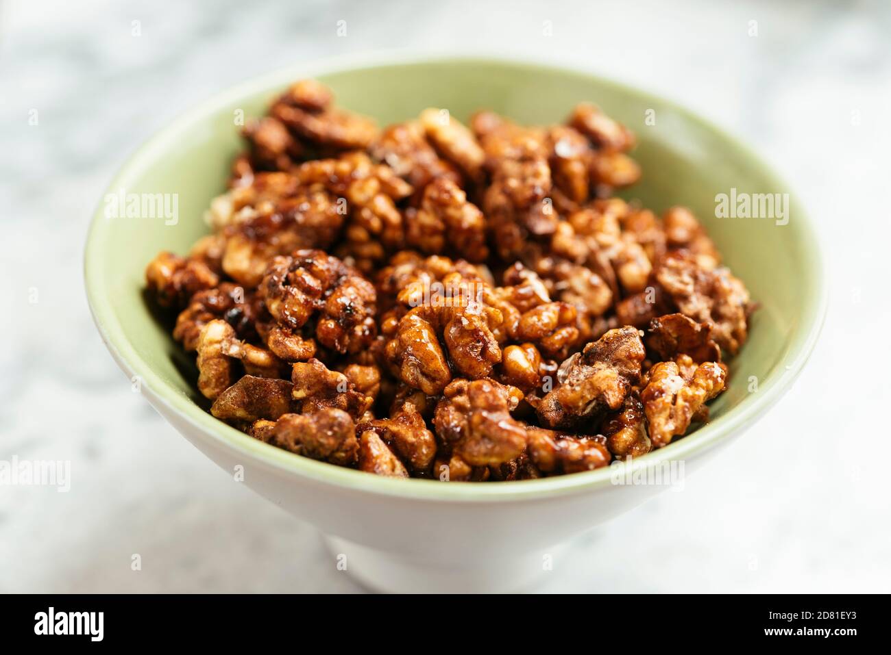 Home made spicy candied walnuts. Stock Photo