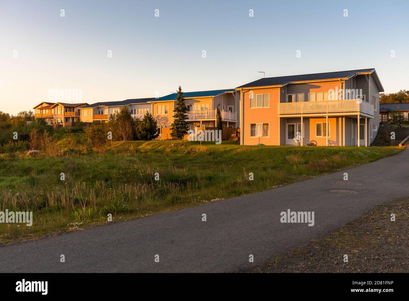 New detached houses in a housing development at sunset Stock Photo