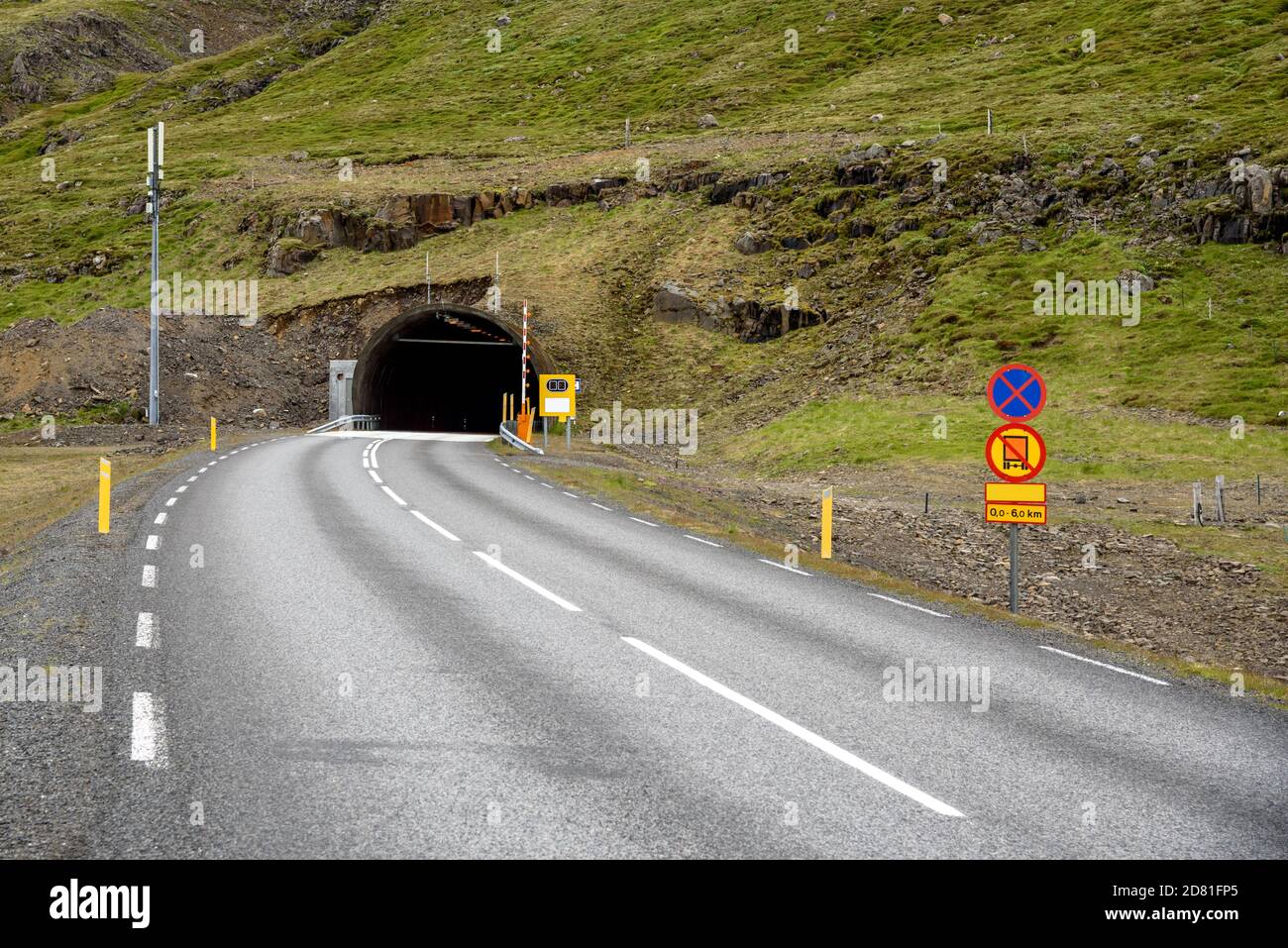 Entrance of a road tunnel under a mountain in Iceland Stock Photo
