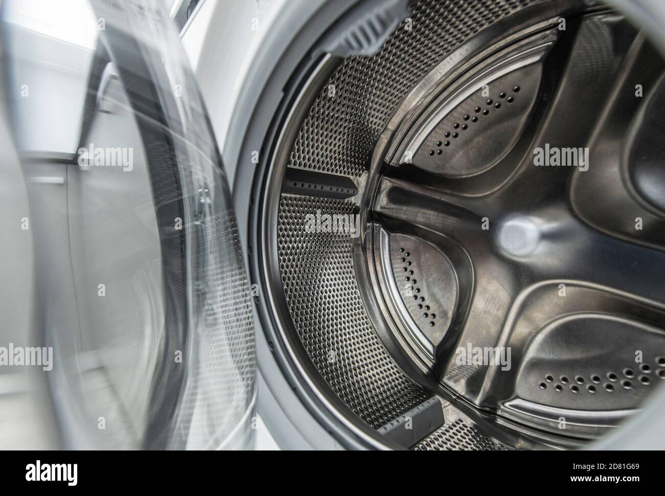 Home Appliance Used to Wash Laundry. Clean Washing Machine Drum Interior Stock Photo