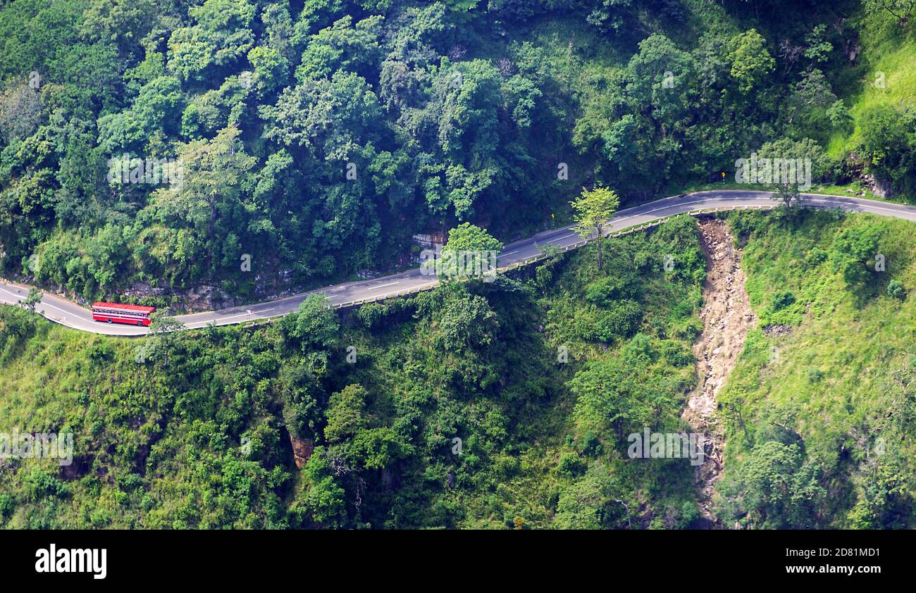 Dangerous section of mountain road without fencing runs along a steep cliff  face, Sri Lanka roads Stock Photo - Alamy