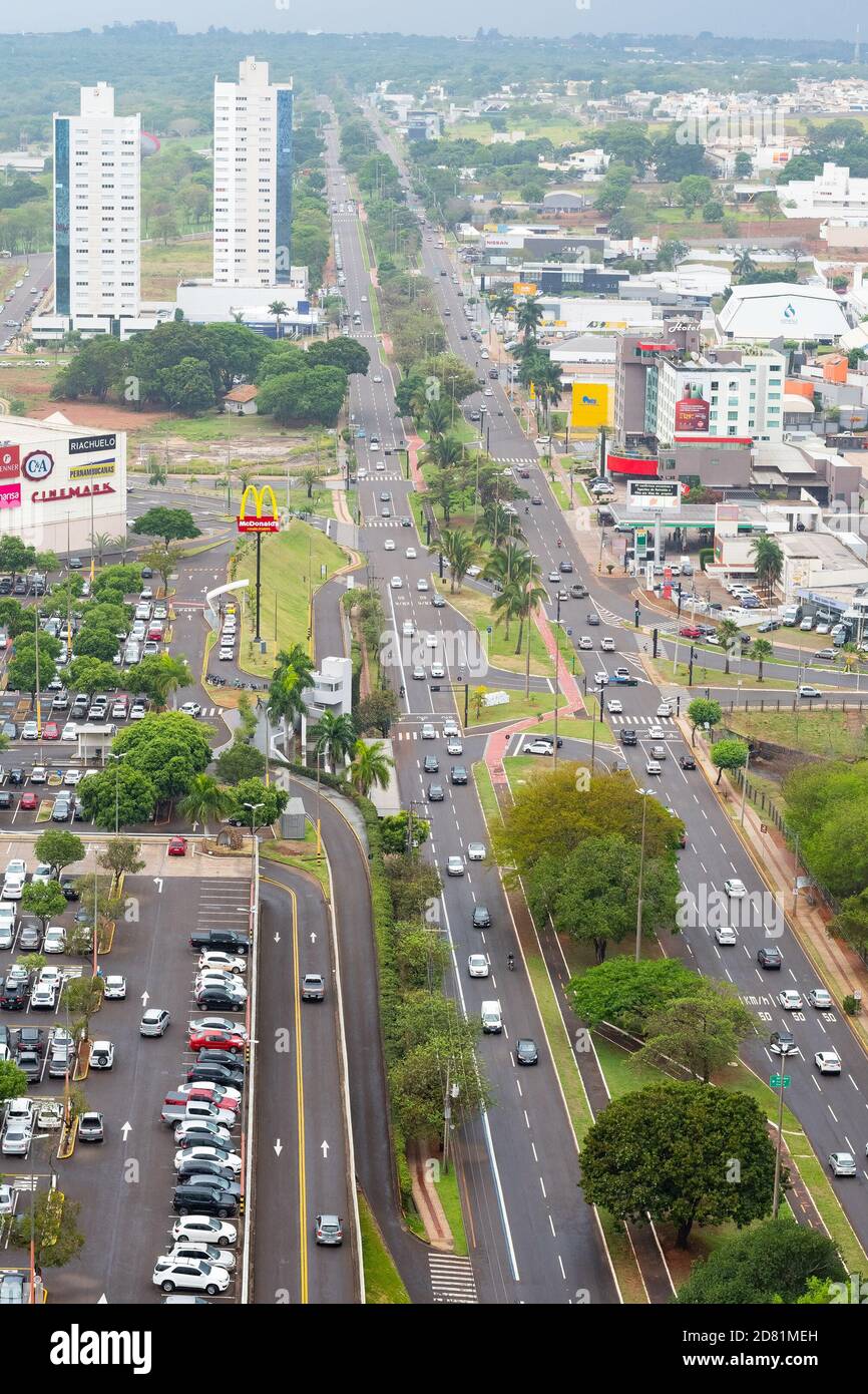 Campo Grande - MS, Brazil - October 23, 2020: Aerial view at the traffic of the Afonso Pena avenue in front of the Shopping Campo Grande mall. Highs o Stock Photo