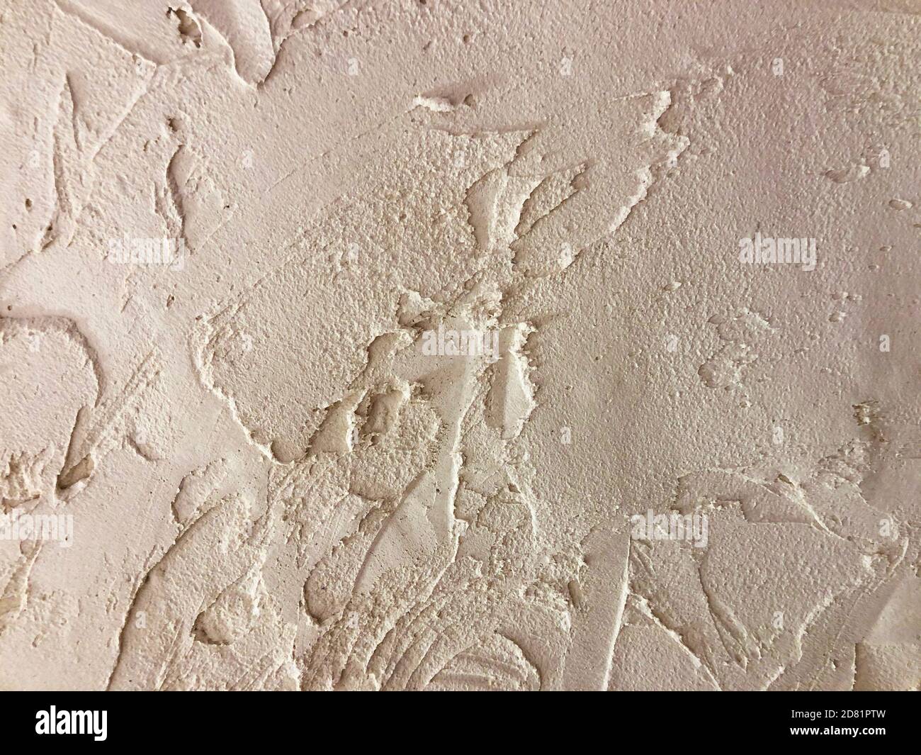 Textured plaster. Beige wall stucco texture. Plastered background Stock Photo