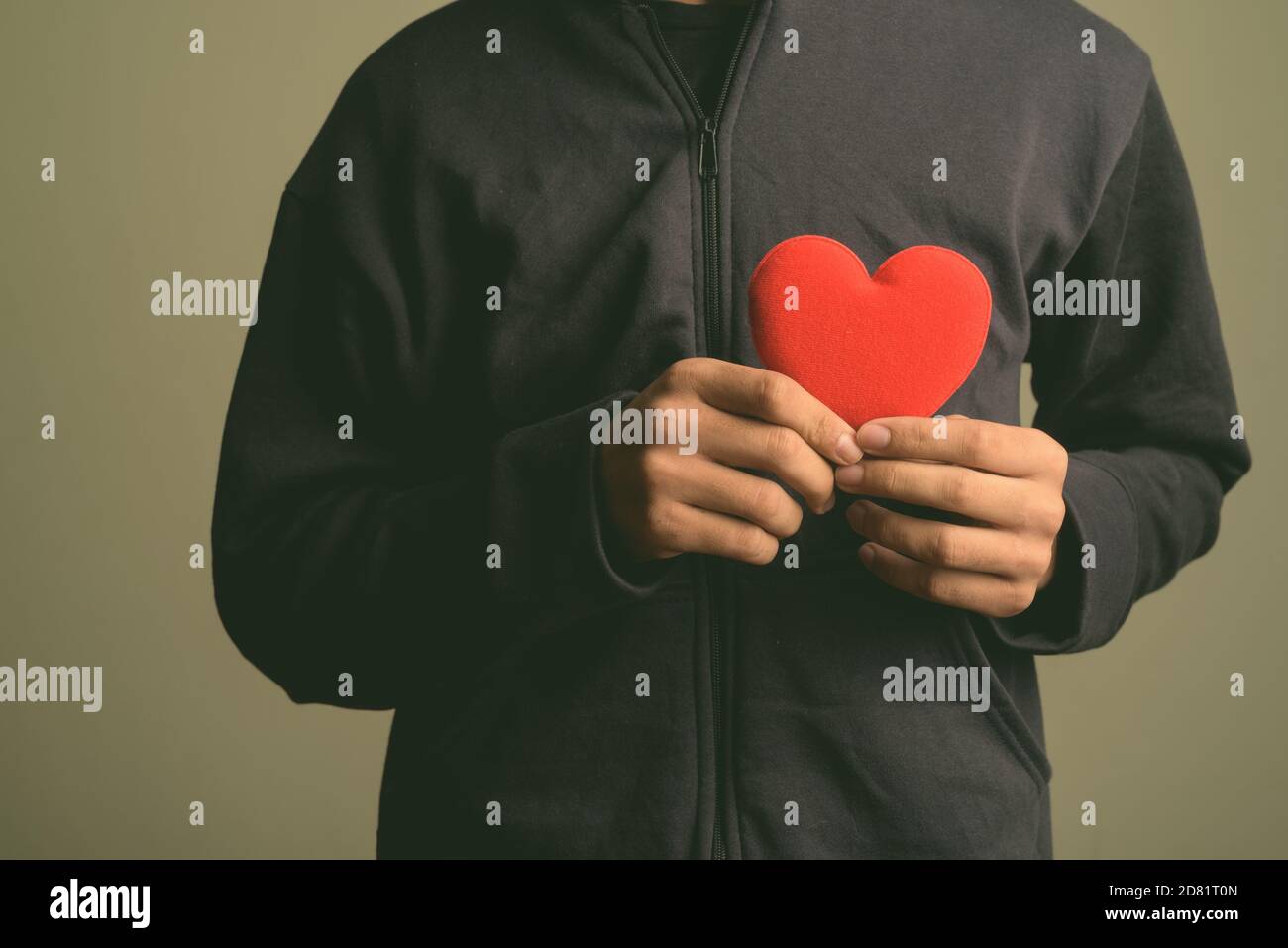 Hand holding clothes hi-res stock photography and images - Alamy