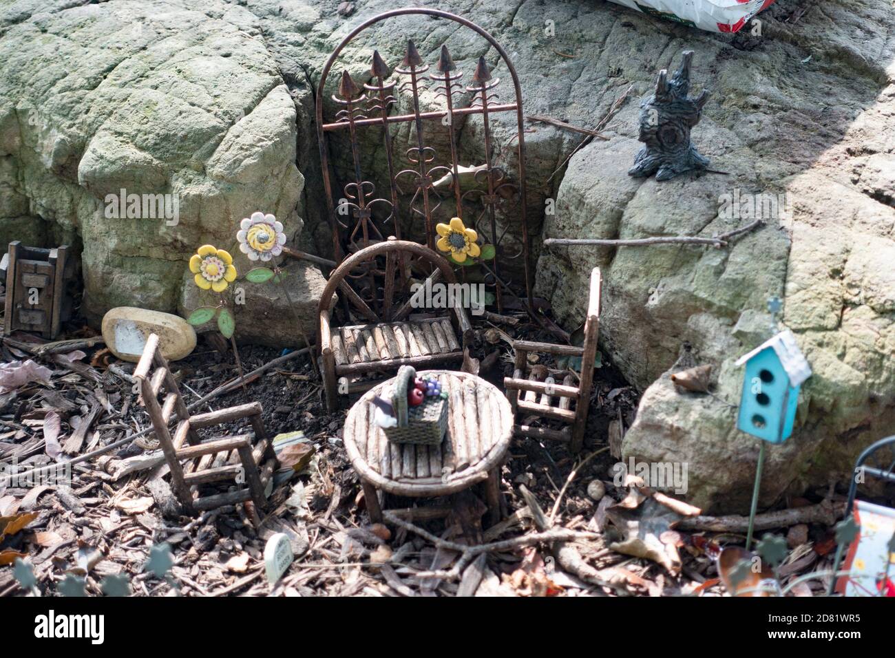 Miniature hobbitlike outdoor dining area with gate to inner tunnel. Downers Grove Illinois IL USA Stock Photo
