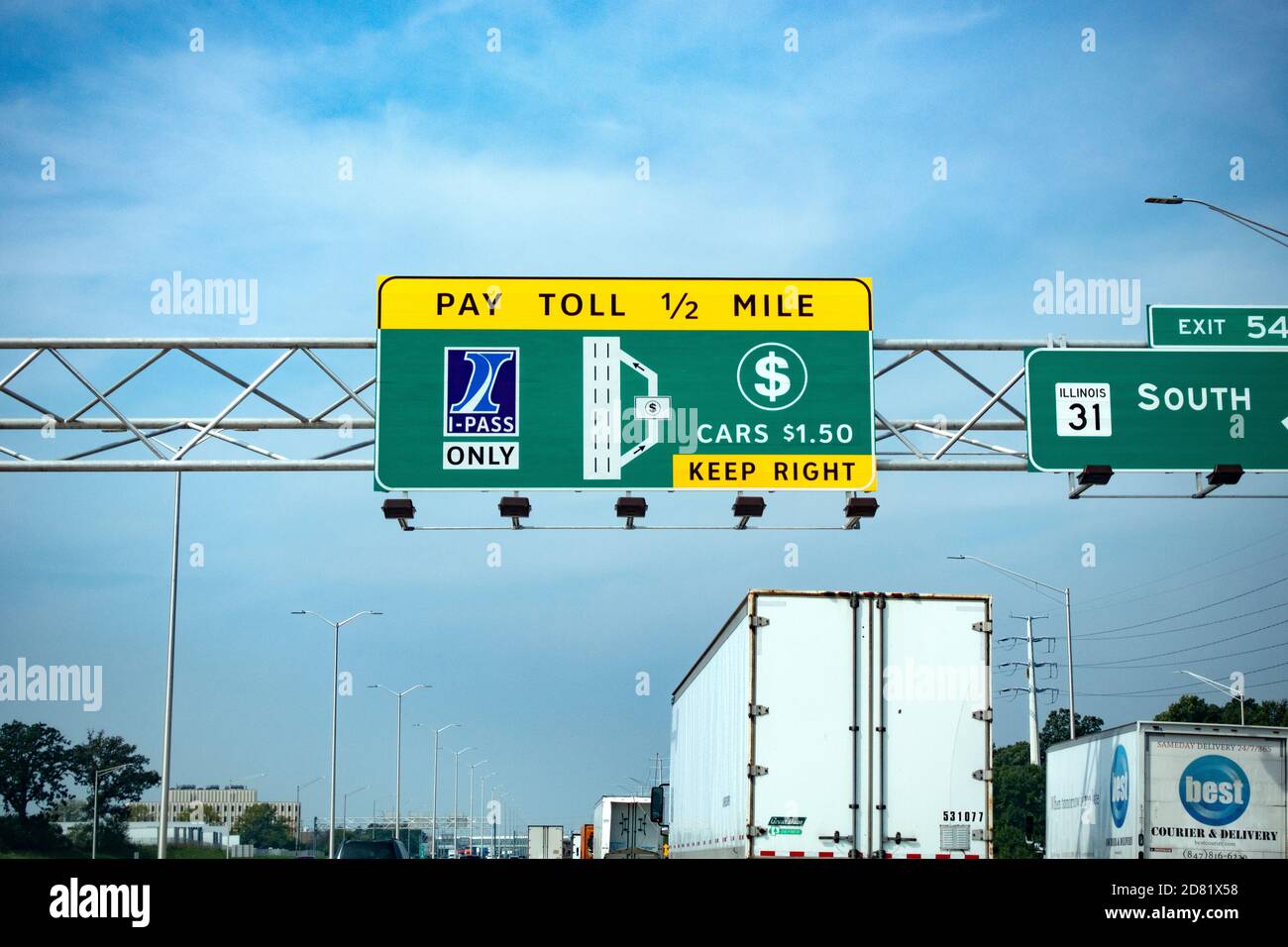 Overhead directional lane signs for the electronic and manual collection of tolls on the freeway. Chicago Illinois IL USA Stock Photo