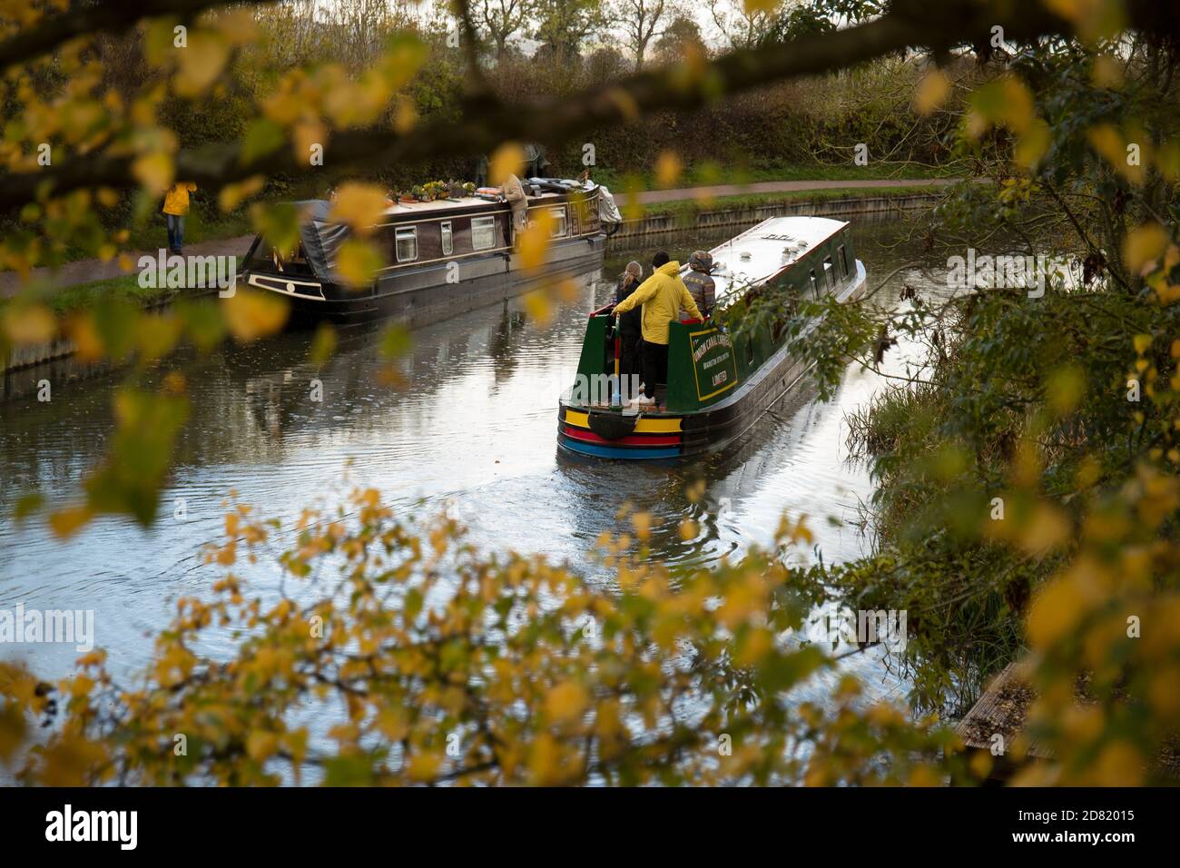 A Narrow Boat travels along the Grand Union Canal, at Foxton in Leicestershire England. Stock Photo