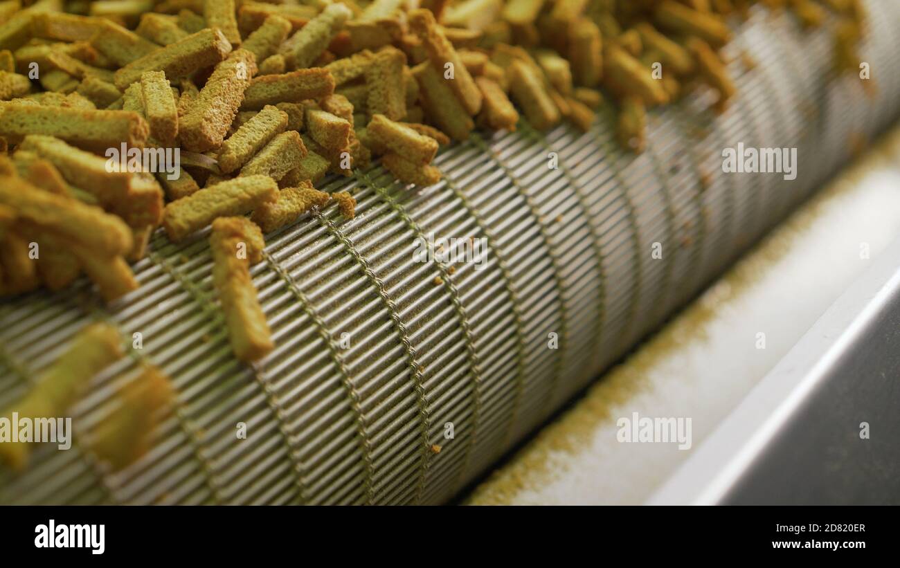 The process of making crackers. Cracker production. Croutons on the