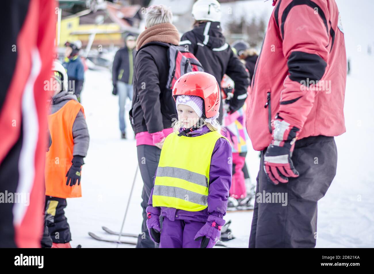 child and ski instructor in winter slope learning and teaching how to ski Stock Photo