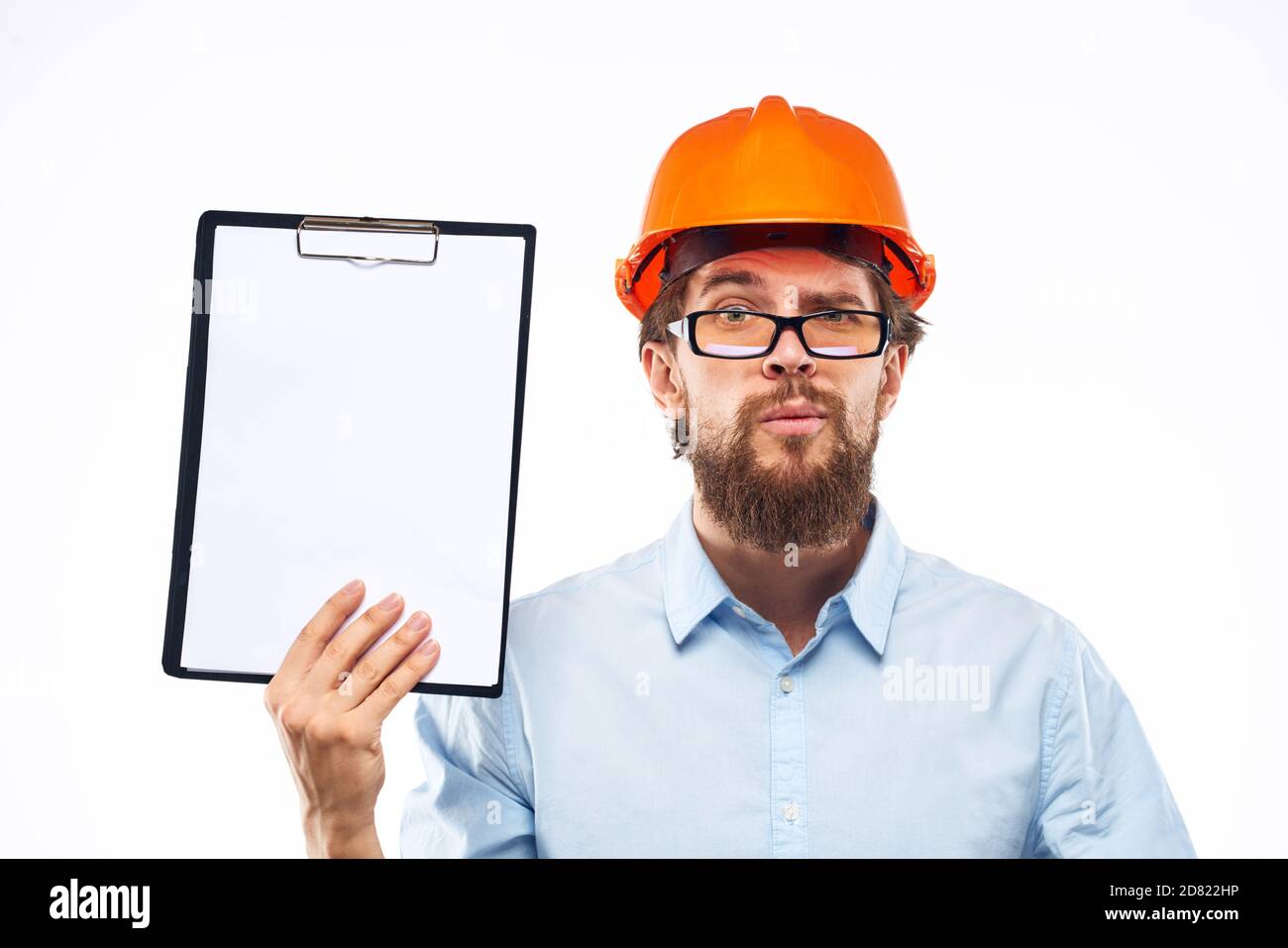 Cheerful workers orange paint documents construction industry light background Stock Photo Alamy