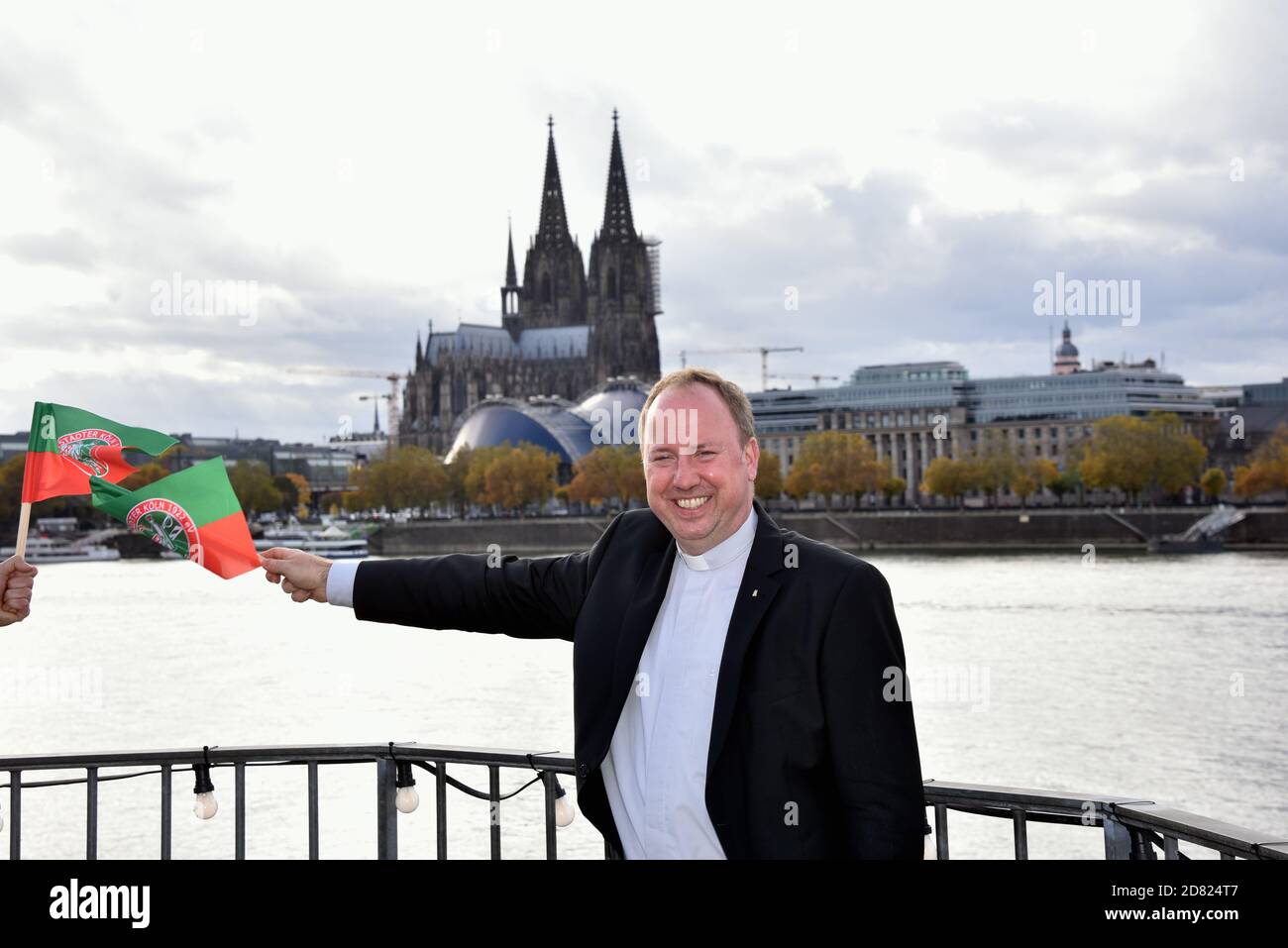 Cologne, Germany. 26th Oct, 2020. Msgr. Robert Kleine Stadtdechant of Cologne and Domdechant of Cologne Cathedral poses at the presentation of the Cologne Carnival triumvirate of Session 2021, leading through the new session, which has the motto 'Nur zesamme sin mer Fastelovend' (Only together we are carnival) Credit: Horst Galuschka/dpa/Alamy Live News Stock Photo