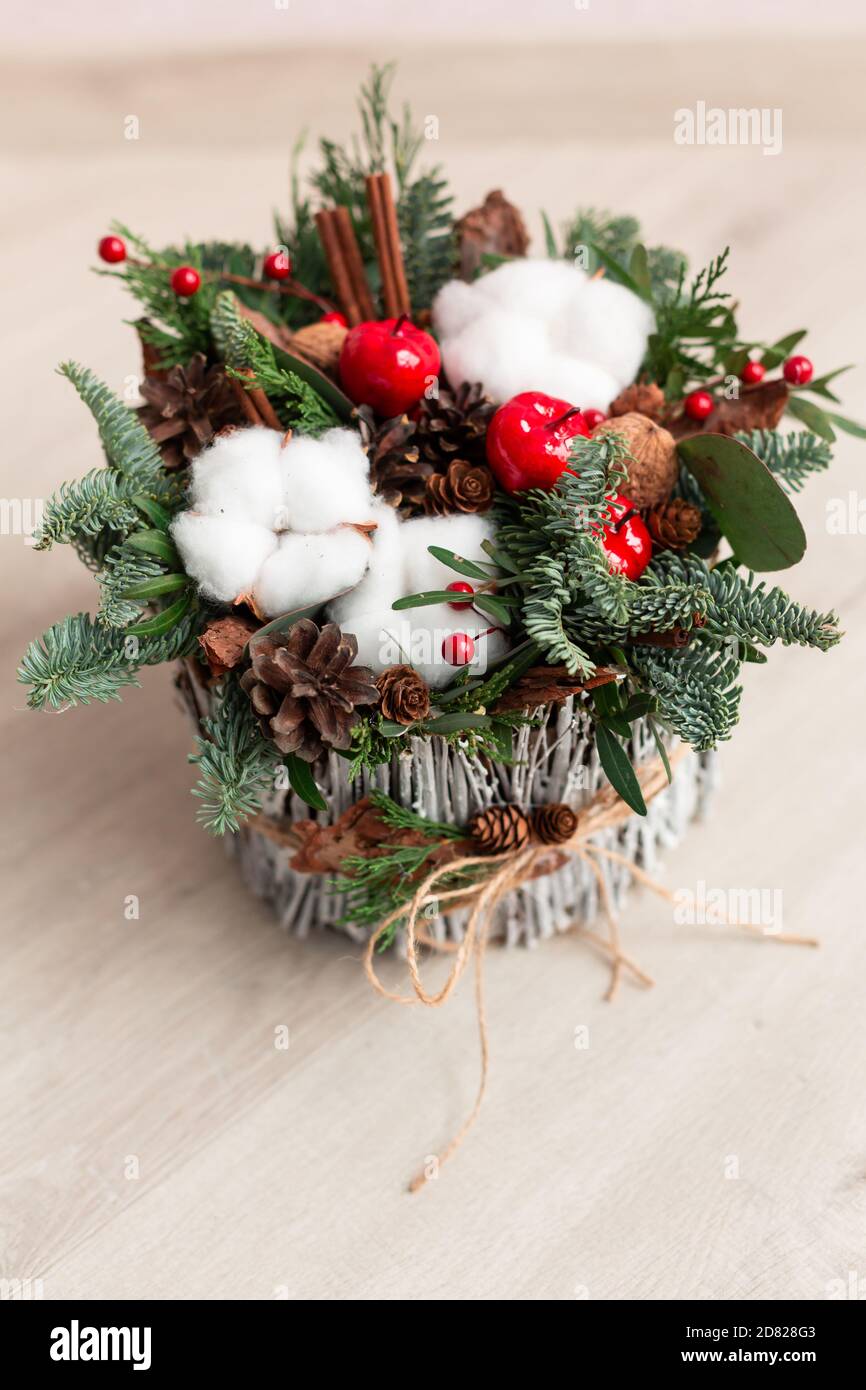 Christmas decoration with carnations, chrysanthemums santini, brunia and fir. Christmas spirit and mood Stock Photo