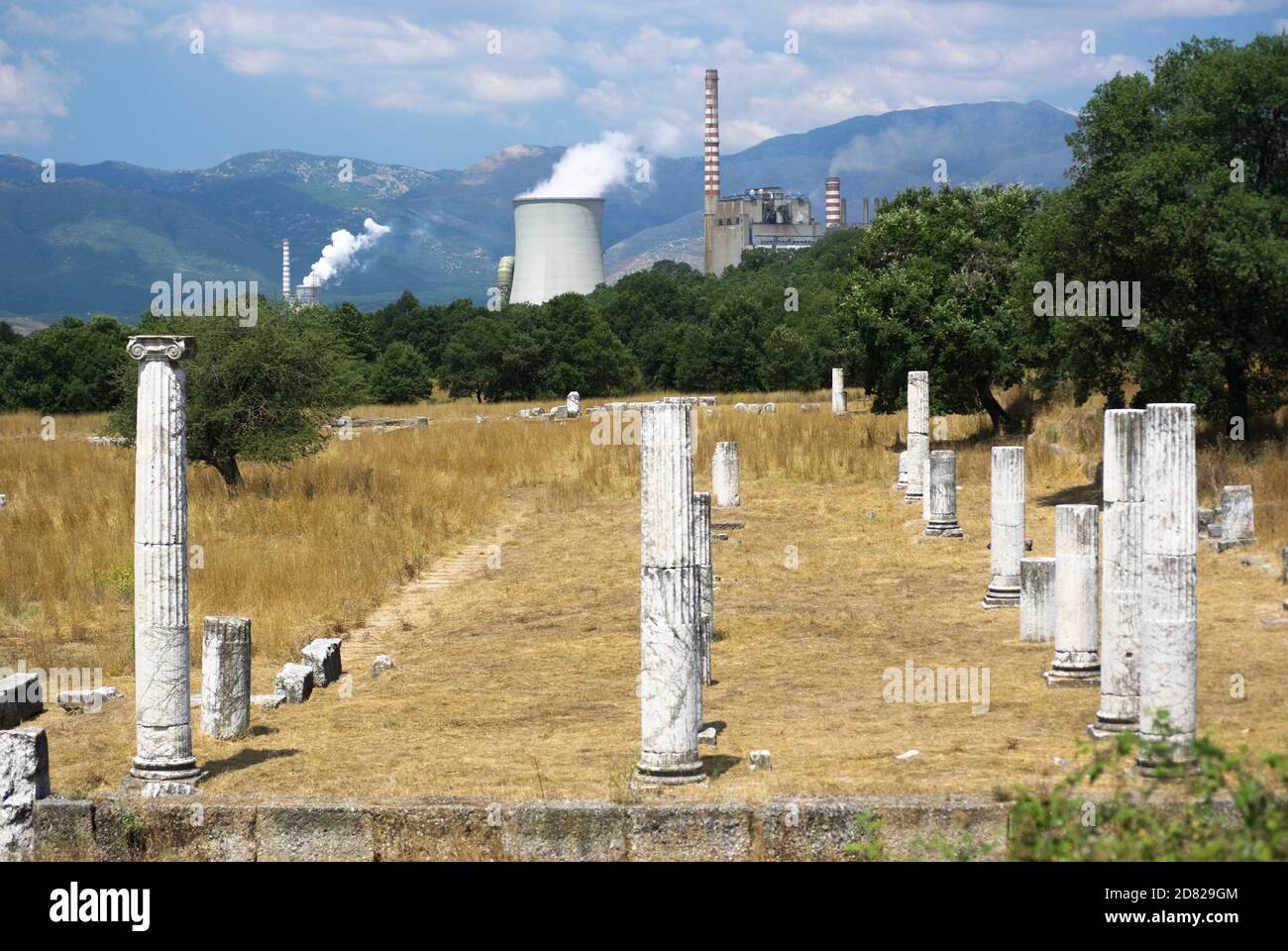 abandoned Archaeological site on background smoke of power station Stock Photo