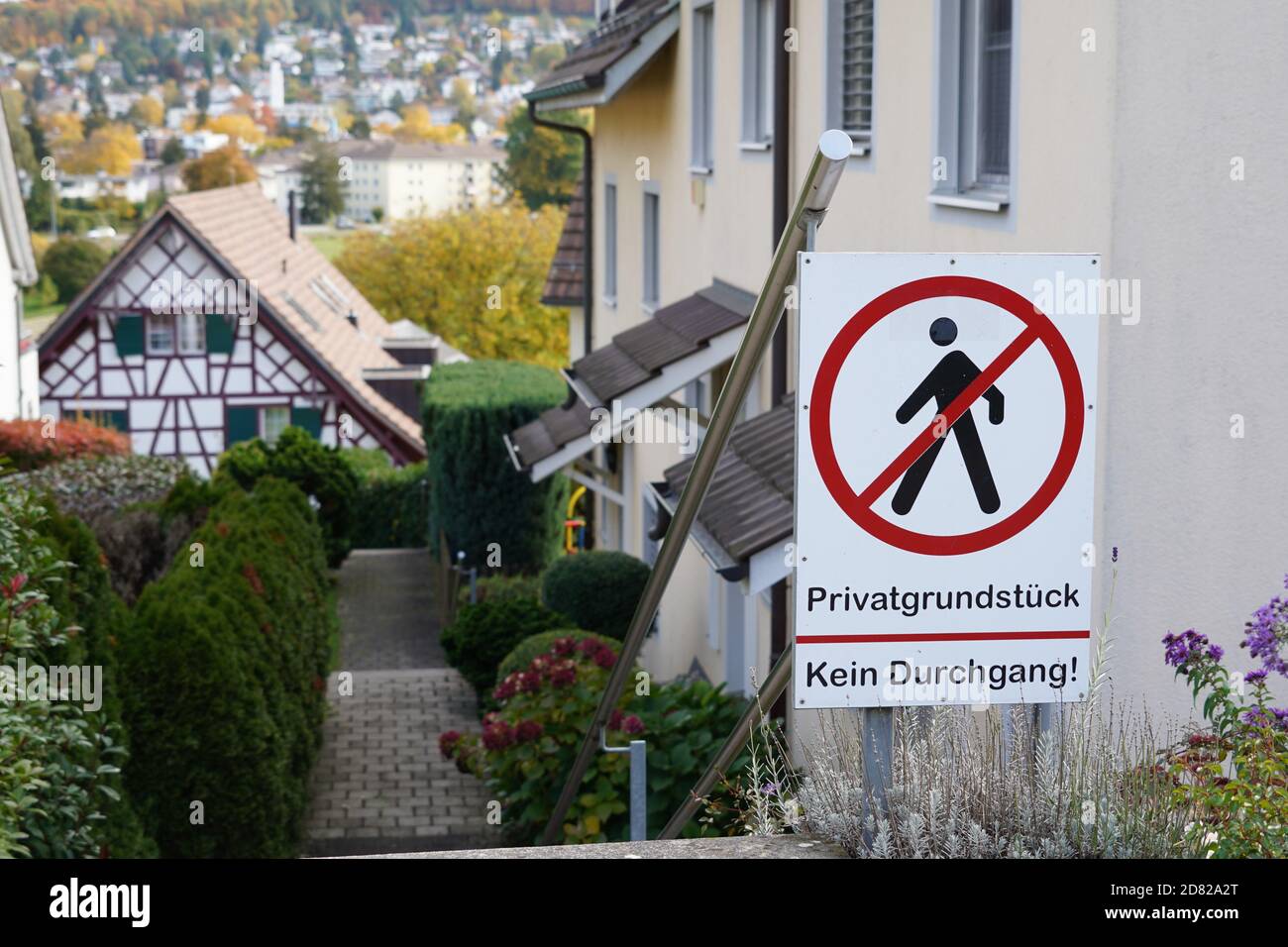 Residential district in a Swiss village with a shield saying in German
