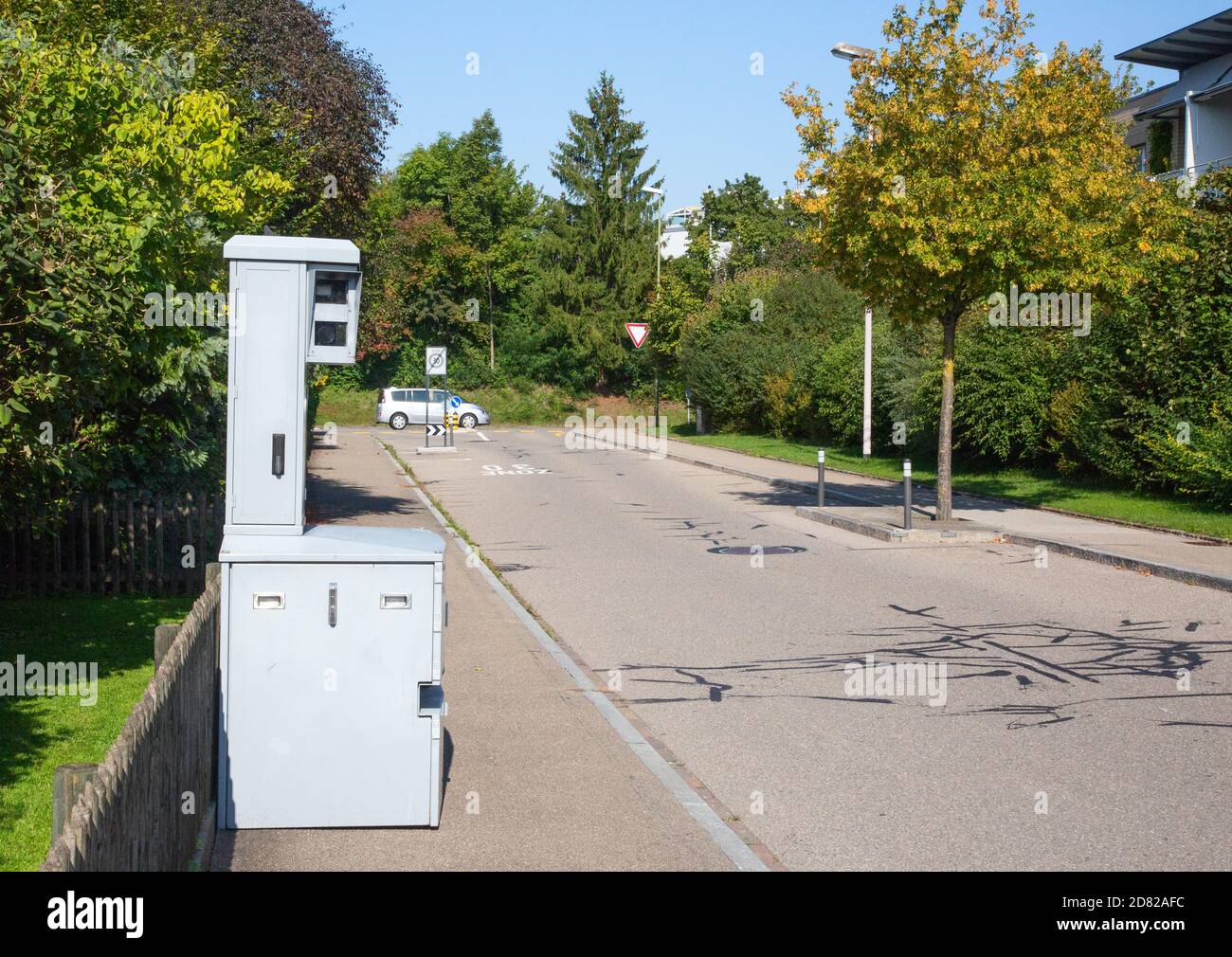Speed camera on the narrow street of small swiss city. The 30 km/h is  typical limit in the living zones in Switzerland Stock Photo - Alamy