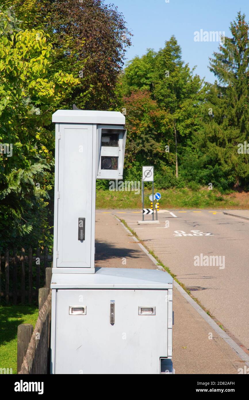 Speed camera on the narrow street of small swiss city. The 30 km/h is