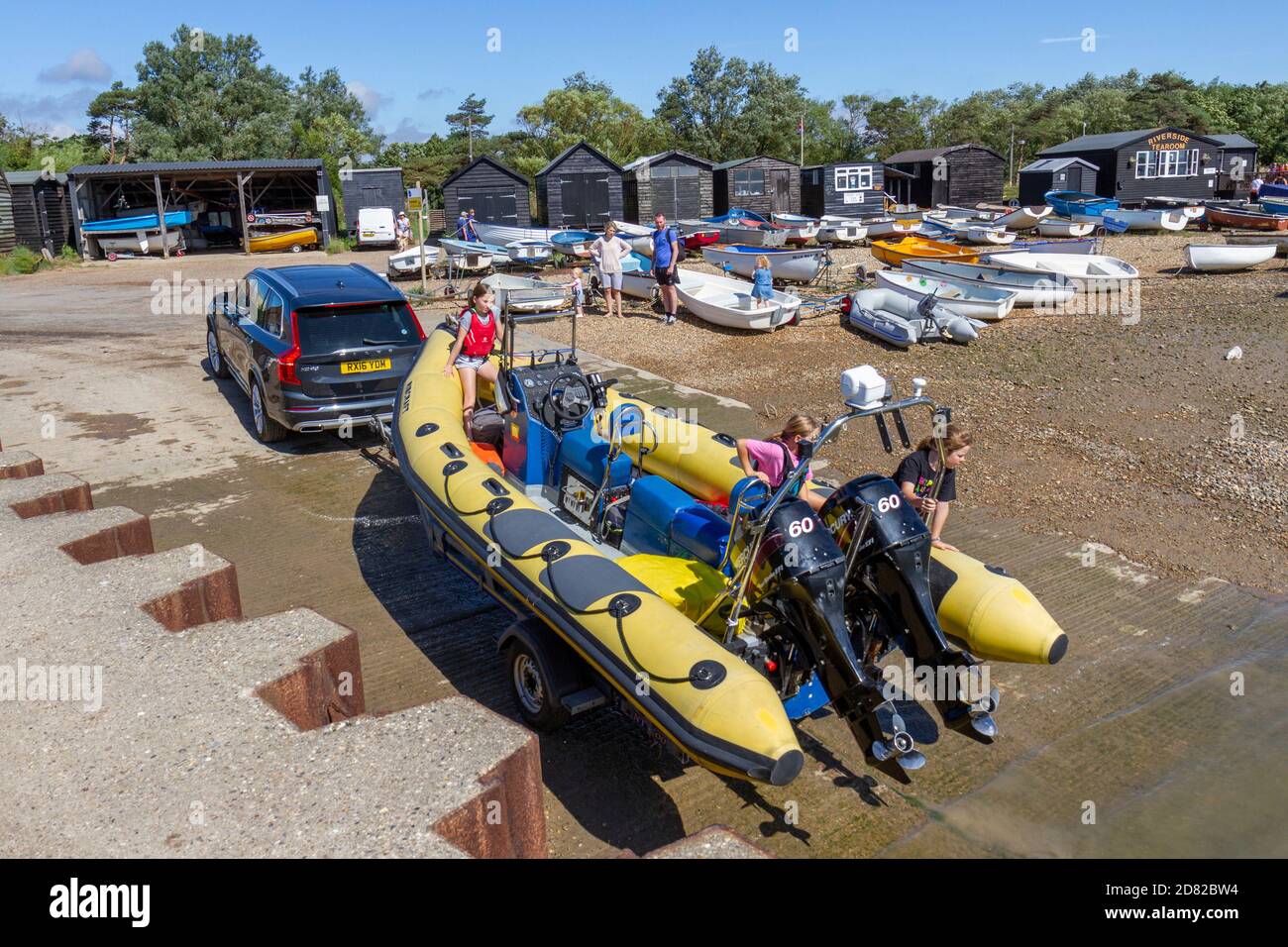 A speed boat being reversed into the sea at Orford Quay, Orford