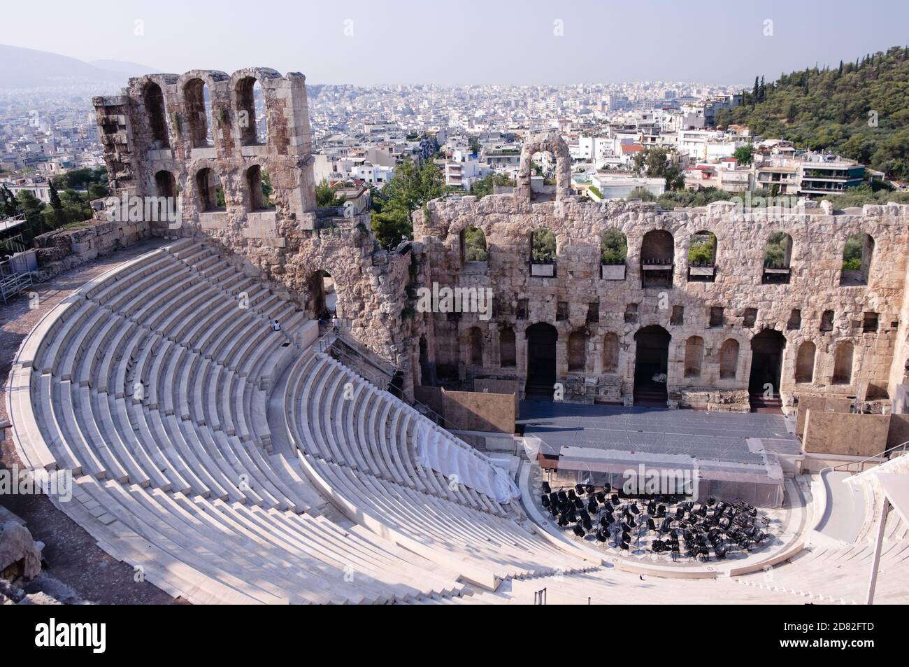 Ancient theatre of Herodes Atticus  is a small building of ancient Greece used for public performances of music and poetry, below on the Acropolis and Stock Photo