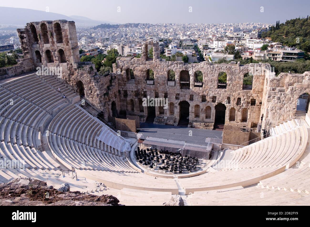 Ancient theatre of Herodes Atticus  is a small building of ancient Greece used for public performances of music and poetry, below on the Acropolis and Stock Photo