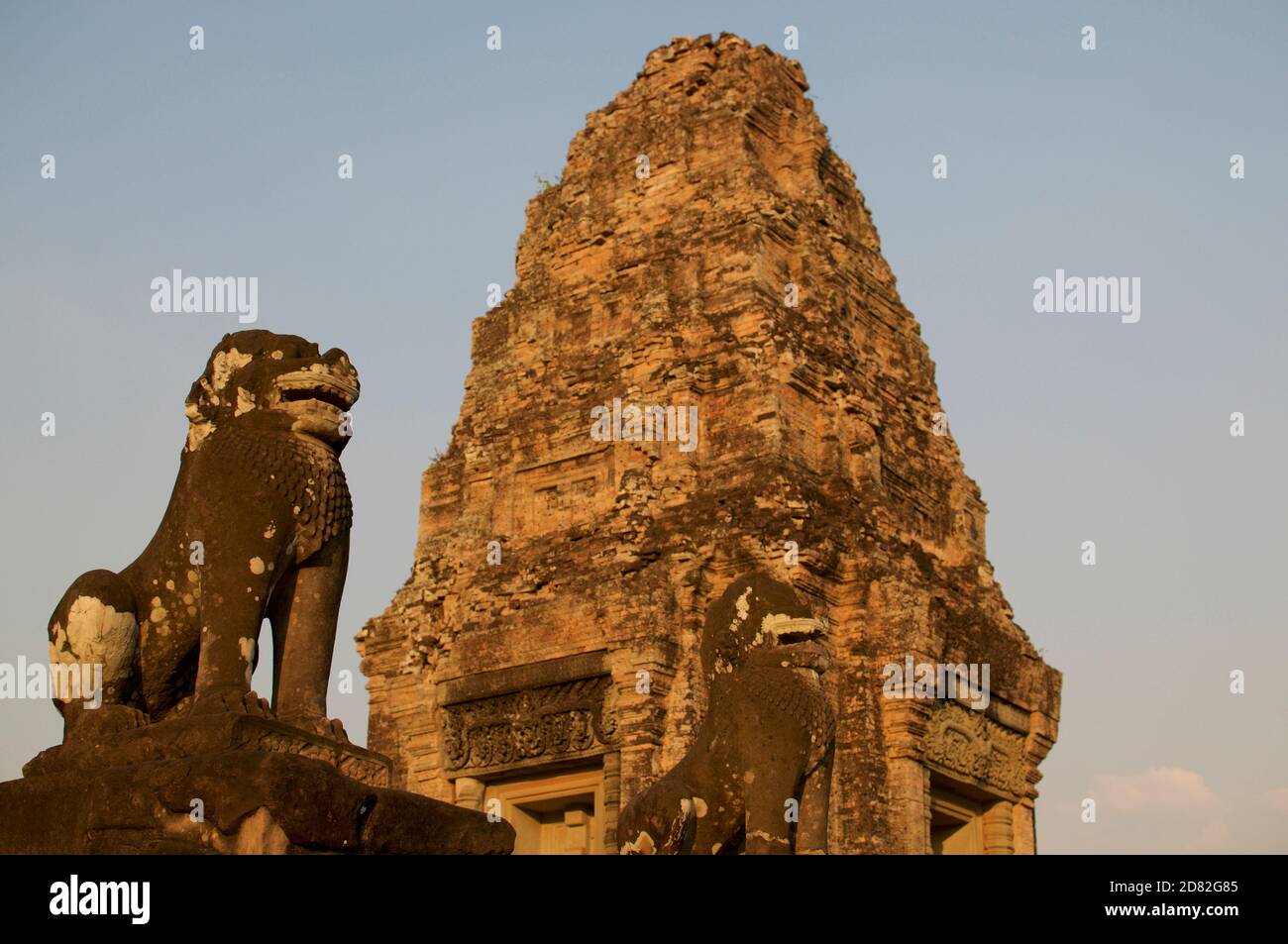Beautiful view of stone guardians an tower during sunset at the Pre Rup temple building located inside the Angkor Wat heritage site in Siem Reap, Camb Stock Photo