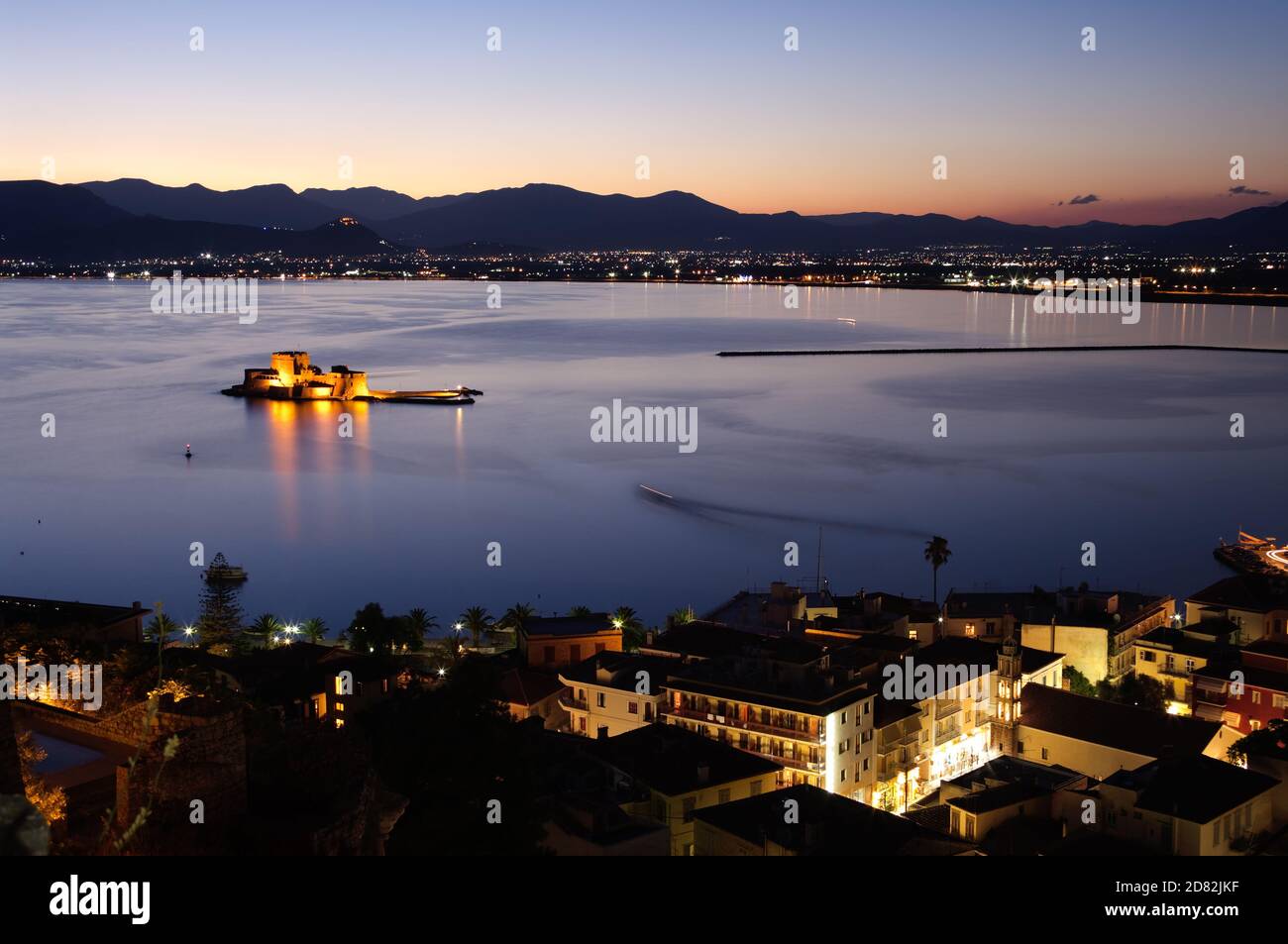 aerial view by night of bay Nauplia at twilight with the castle of Bourtzi on the small island Stock Photo