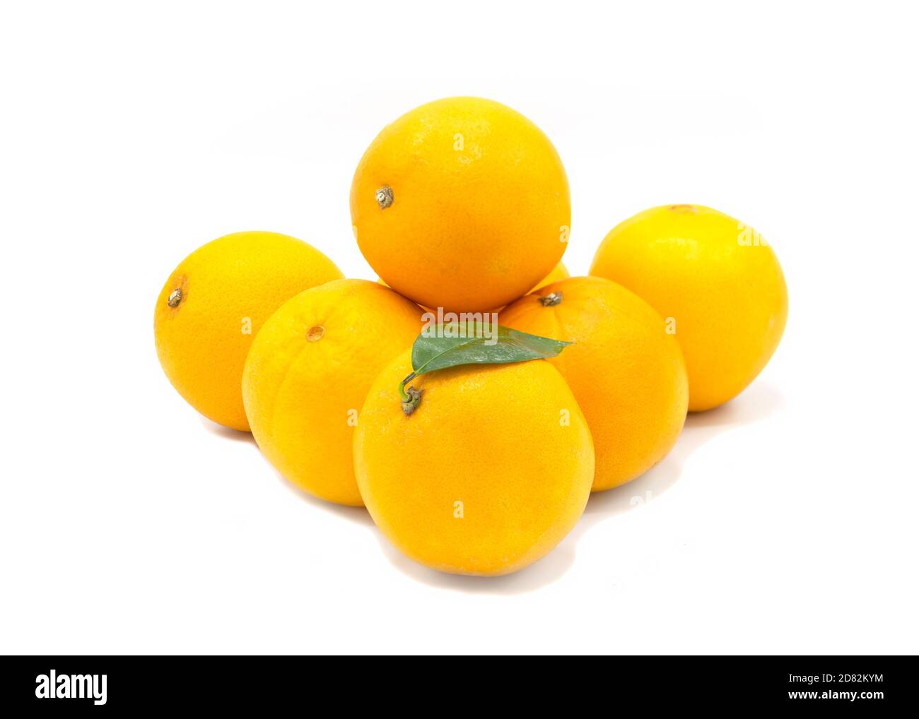 pile of fresh organic Spanish oranges on a white isolated background