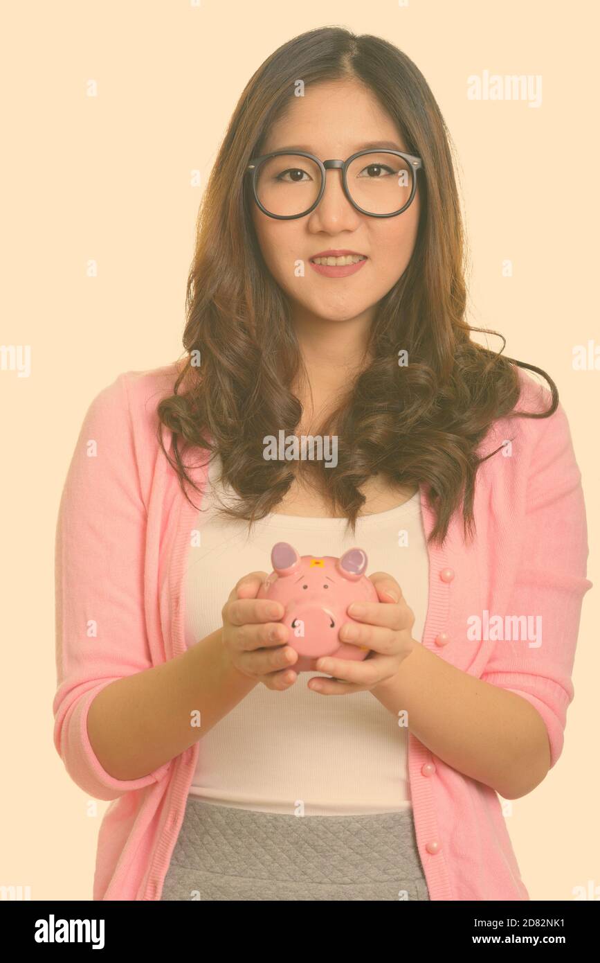 Happy asian woman piggy hi-res stock photography and images - Alamy