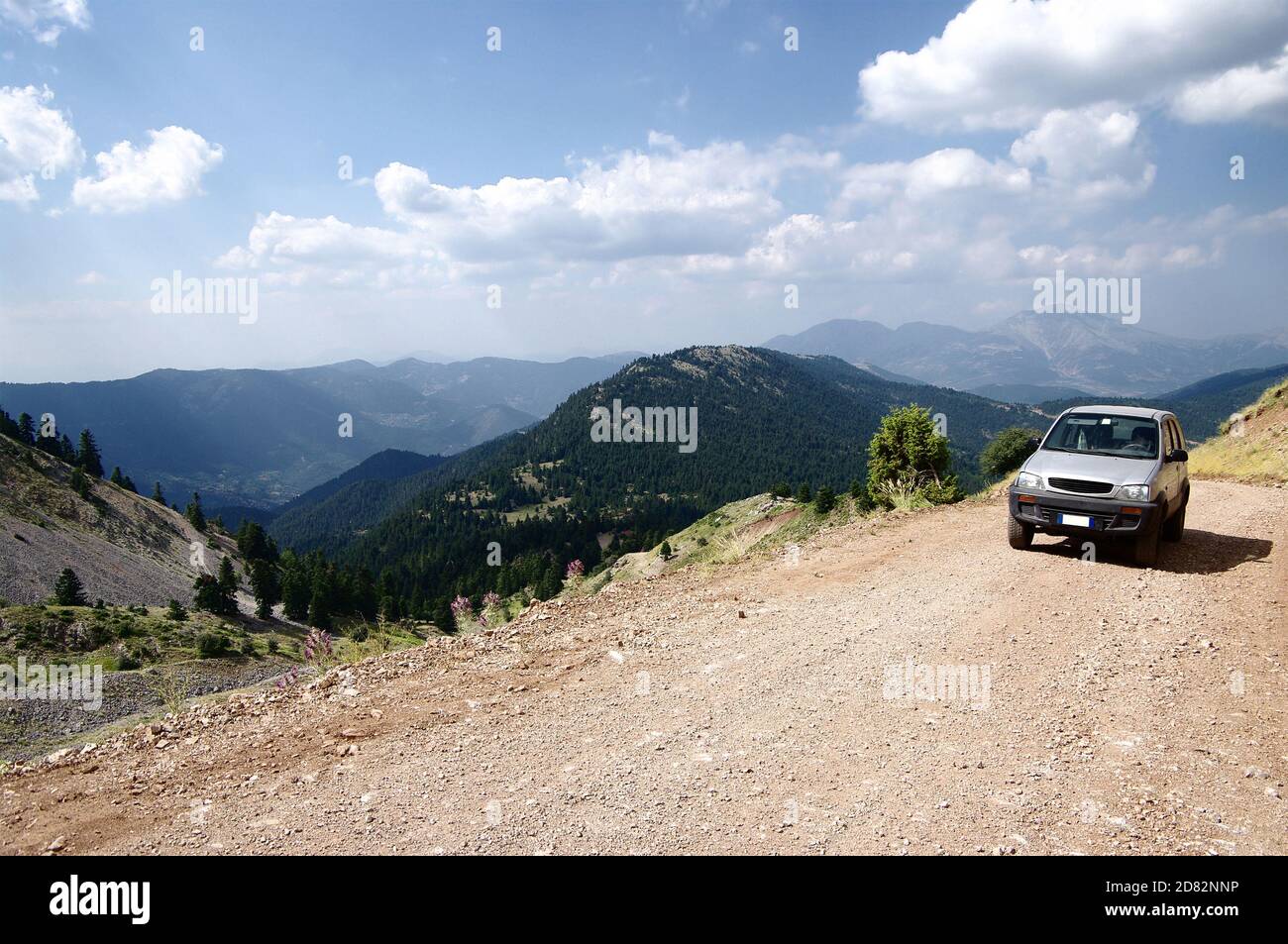 vehicle off-road on dirty road of greek mountain Stock Photo