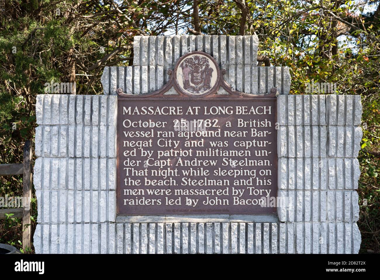 Barnegat Light, NJ - Oct. 15, 2020: This Monument located at the entrance to Barnegat Lighthouse State Park describes the Massacre at Long Beach in 17 Stock Photo