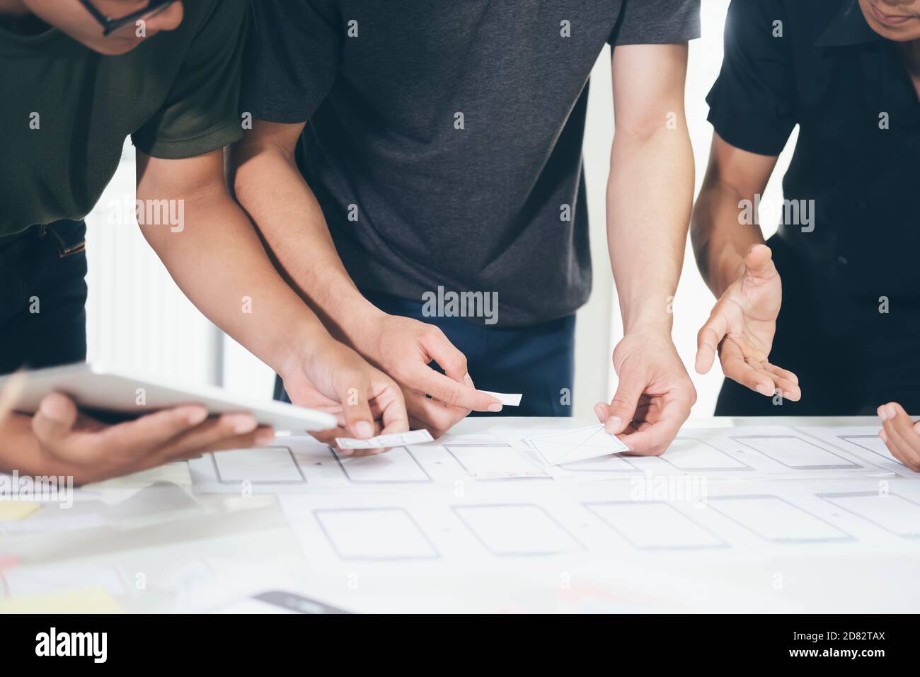 Programmer and UX UI designer working in a software development and coding technologies. Mobile and website design and programing development technolo Stock Photo