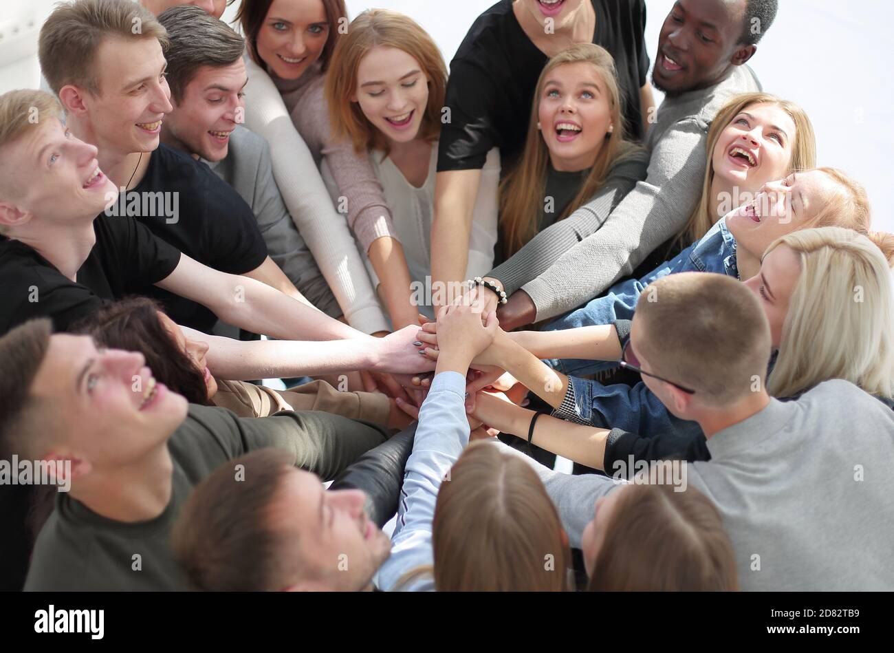 group of diverse people joining their hands in a circle Stock Photo - Alamy
