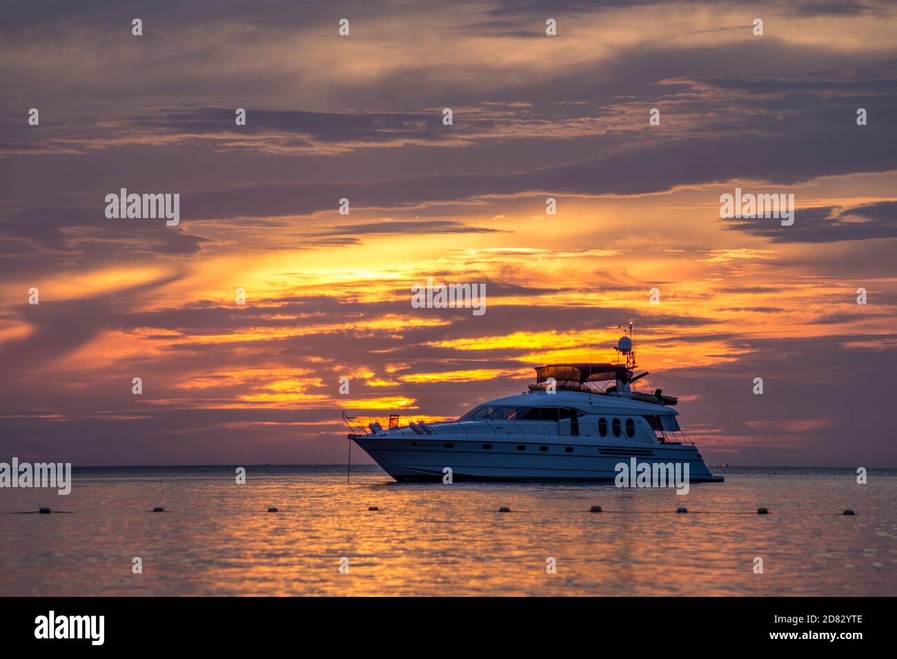 yacht sailing during sunset in ocean Stock Photo - Alamy