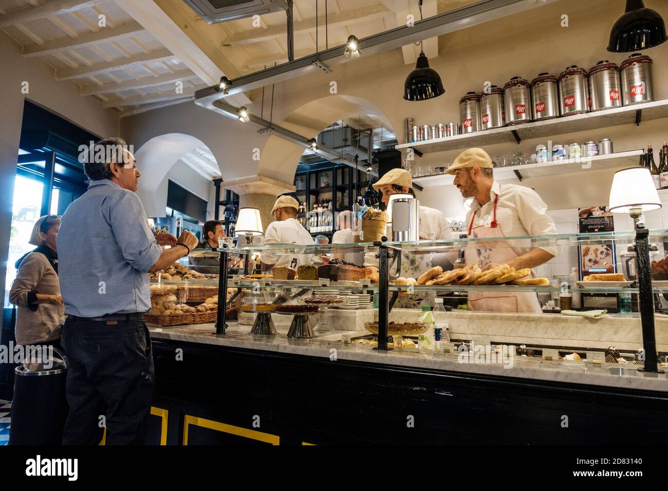 Customers ordering food, Forno Monteforte Pasticceria food counter, Rome, Italy. Stock Photo