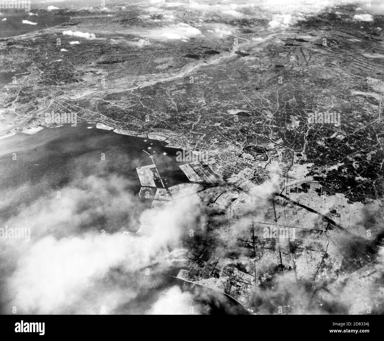 Aerial photo of Tokyo showing effects of first large-scale incendiary bombing attack by U.S. 20th Air Force operations, 1945 Stock Photo
