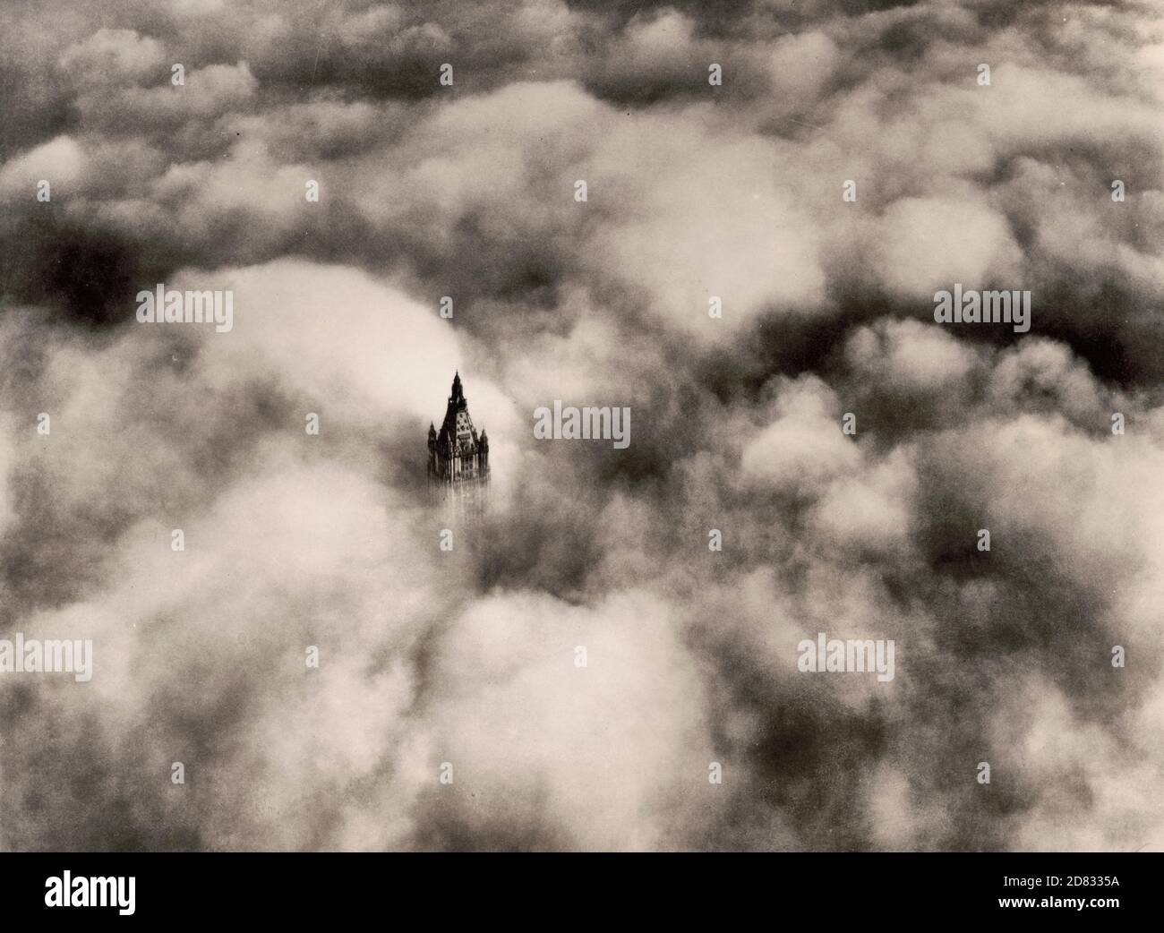 Woolworth tower in clouds, New York City, circa 1928 Stock Photo