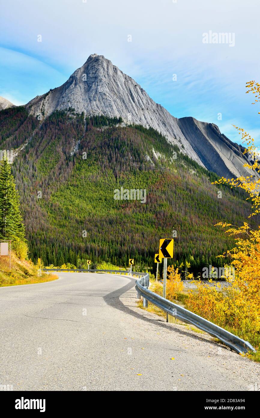 An autumn scene along Medicine lake at a sharp corner with Annunciation Peak in the background in Jasper National Park, Alberta Canada. Stock Photo