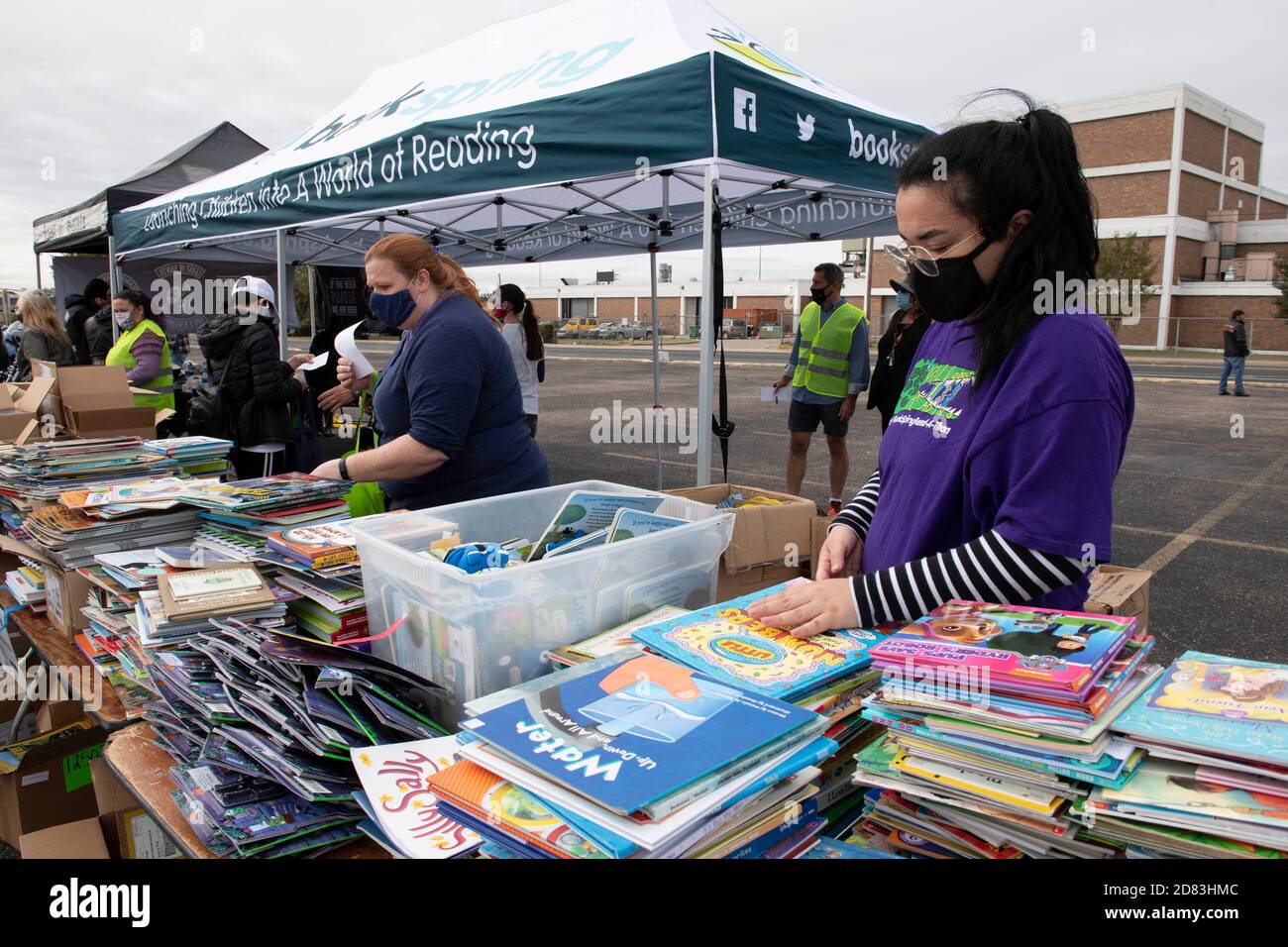 Volunteers sort through books to give away during the 15th annual HopeFest, billed as Austin's largest community-based family resource fair. This year's event, sponsored by Austin Voices, attracted hundreds of families and dozens of vendors in a safe drive-through format. Stock Photo