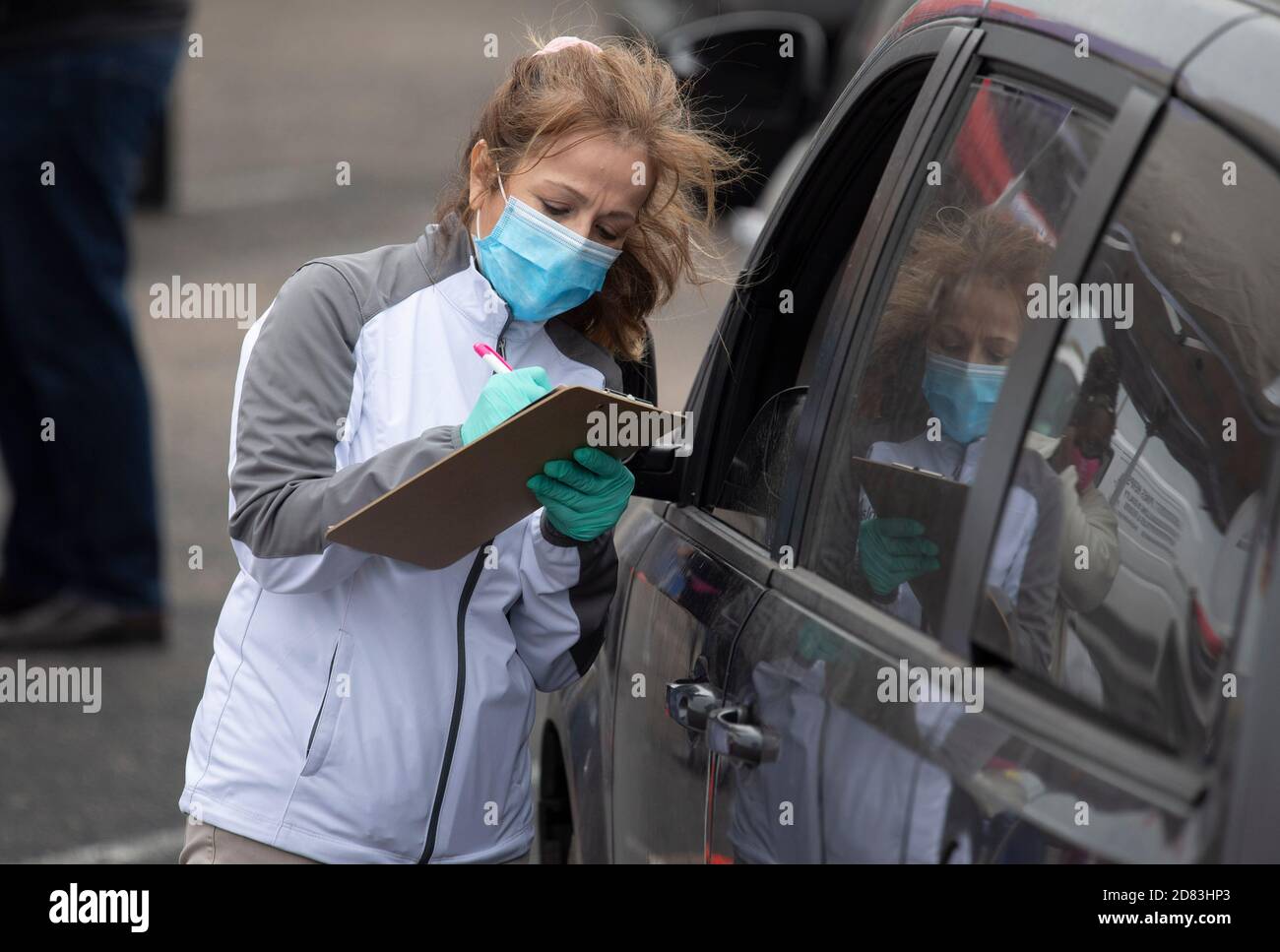Guadalupe Yanez, representing a health insurance provider, collects