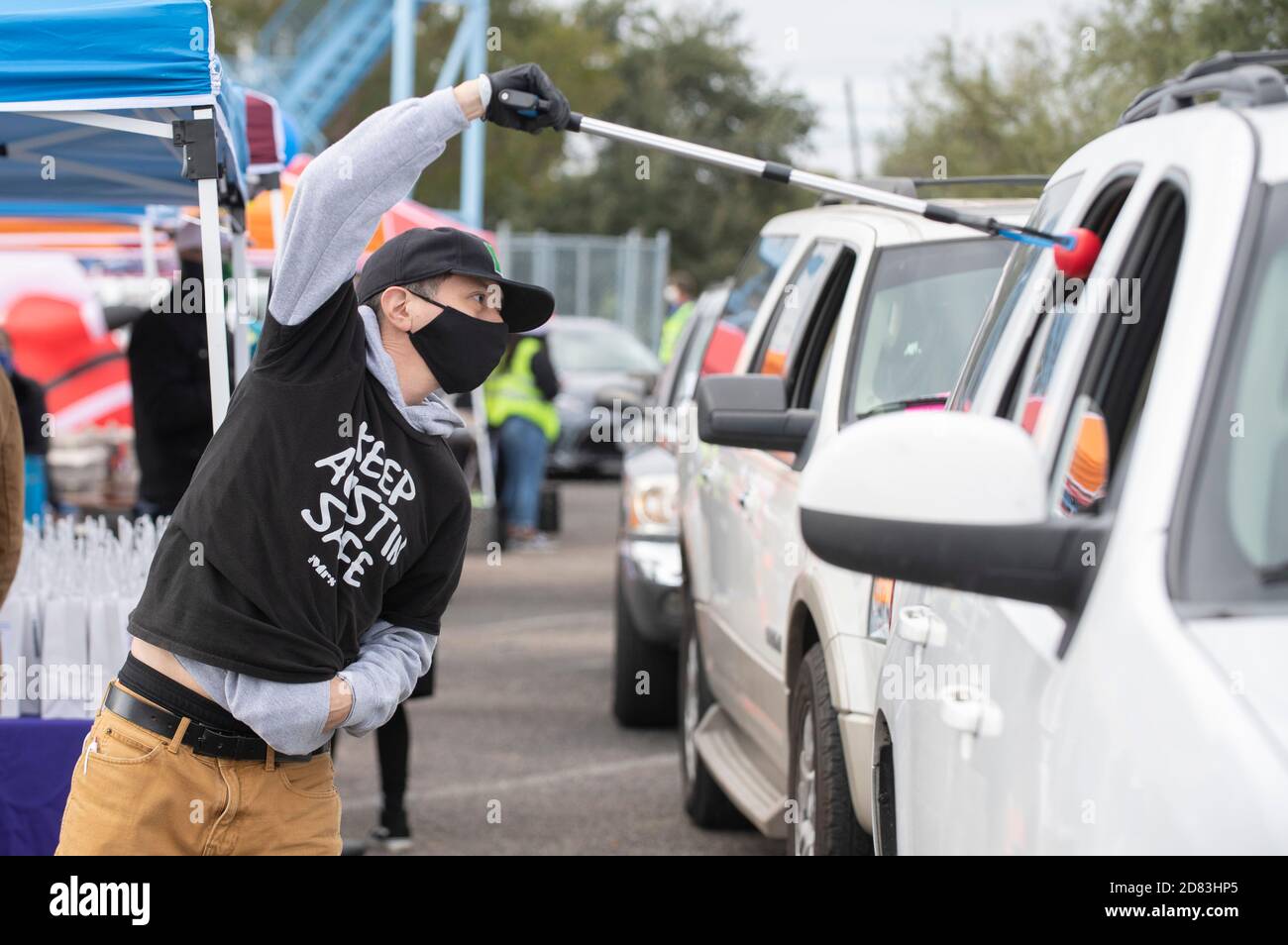 Vincent Tovar of Strong Start finds a unique way to distribute stress balls to people during the 15th-annual HopeFest, billed as Austin's largest community-based family resource fair. This year's event, sponsored by Austin Voices, attracted hundreds of families and dozens of vendors in a safe drive-through format. Stock Photo