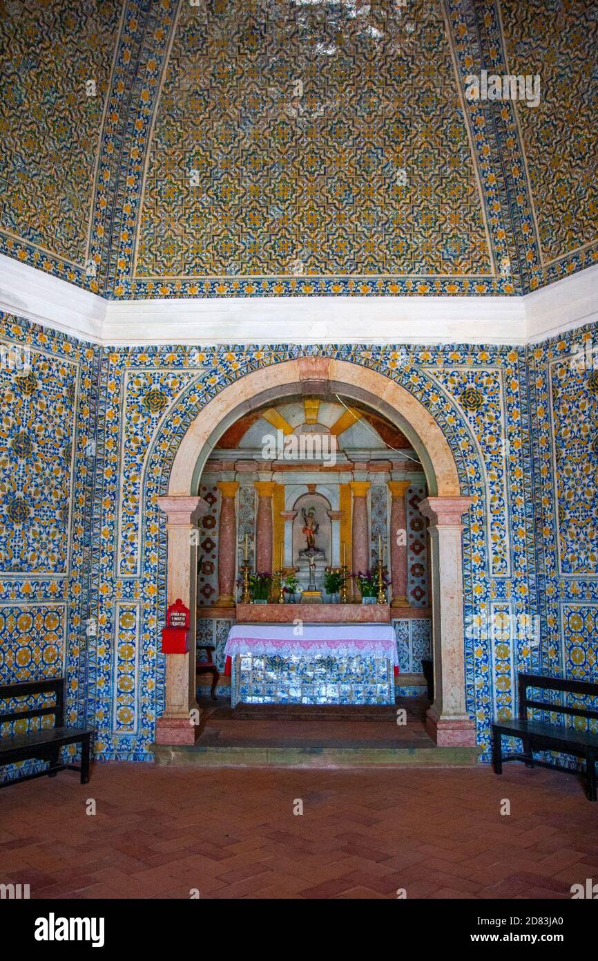 Interior of the Hermitage of Sao Sebastiao where the altar is from the 16th century and the tiles covering the walls are from the 17th century Stock Photo