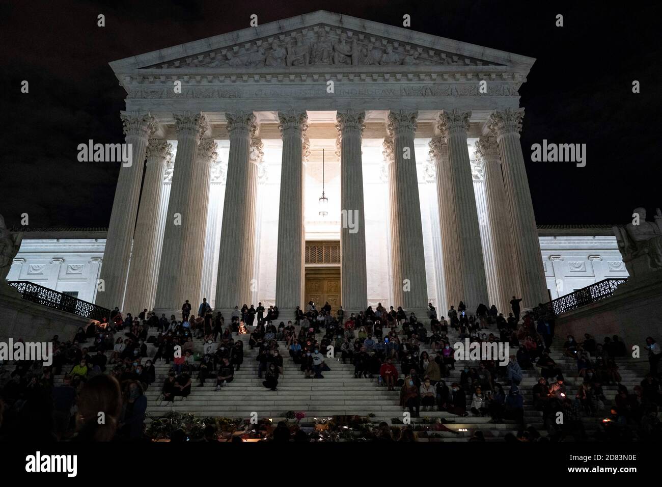 Mourners gather on the steps of the Supreme Court after the passing of US Supreme Court Justice Ruth Bader Ginsburg, in Washington, DC, on September 18, 2020. - Progressive icon and doyenne of the US Supreme Court, Ruth Bader Ginsburg, has died at the age of 87 after a battle with pancreatic cancer, the court announced on September 18, 2020 Credit: Alex Edelman/The Photo Access Stock Photo