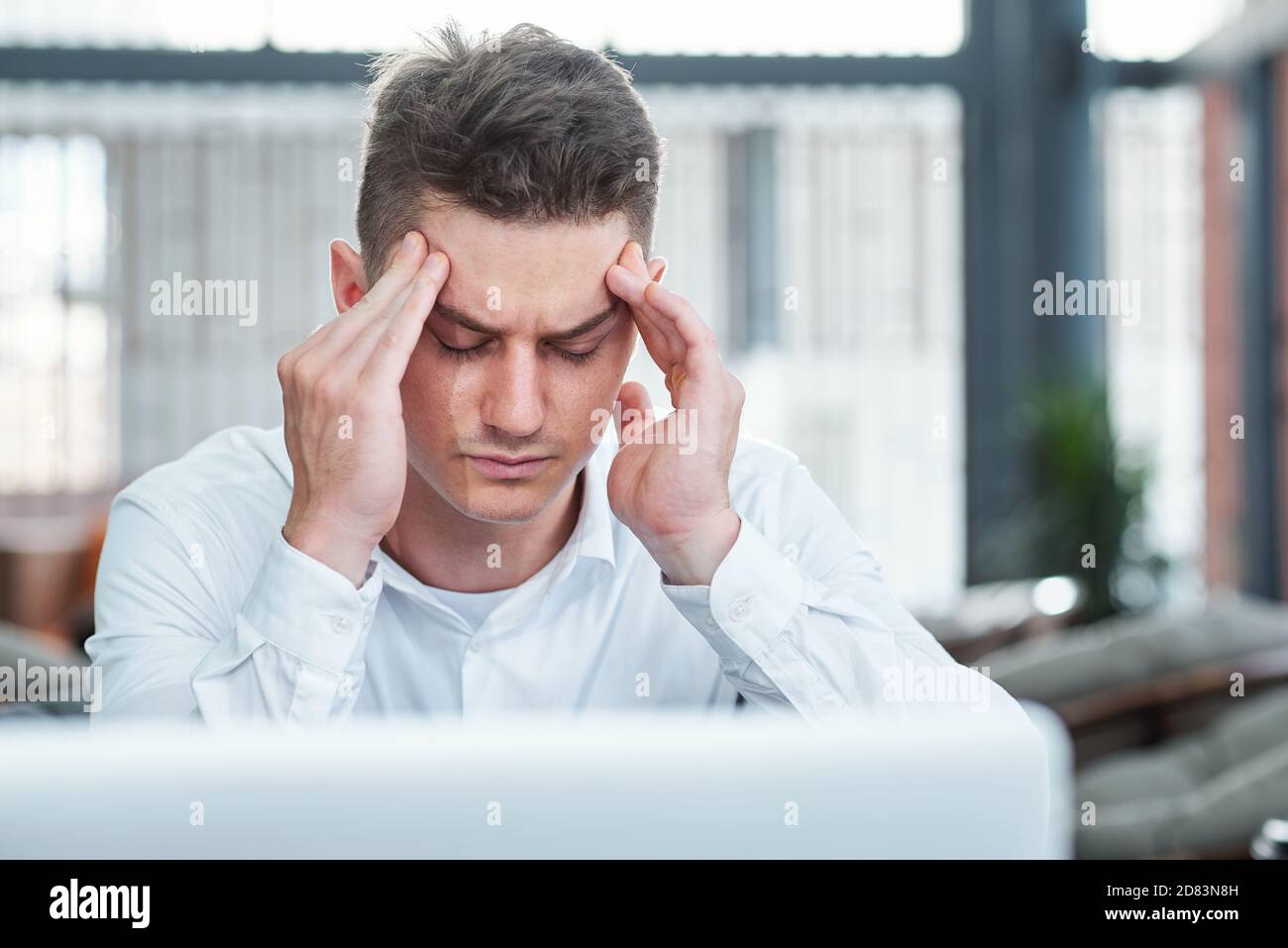 Businessman suffering from headache Stock Photo
