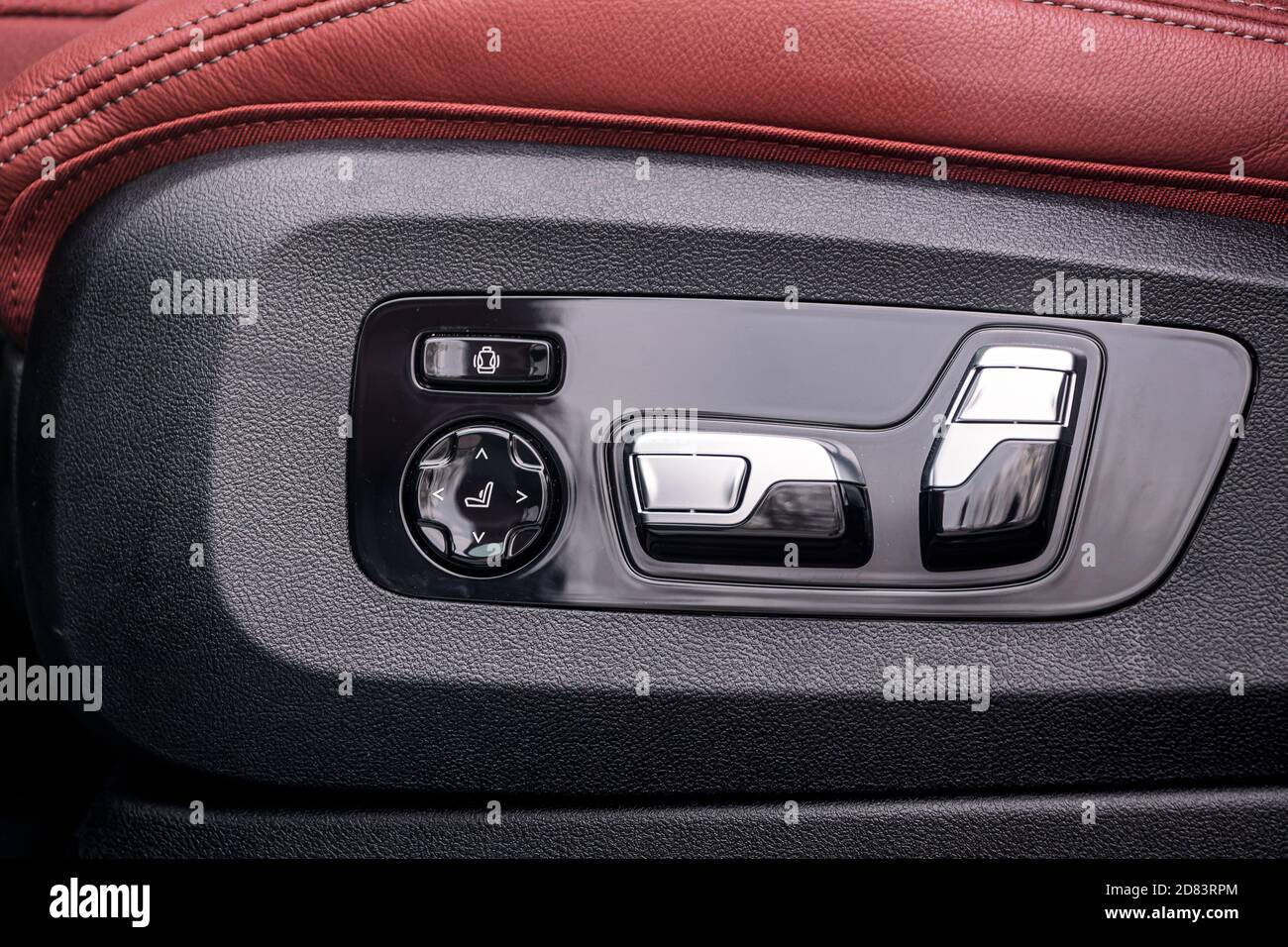 Closeup of height and position adjustment panel for driver's leather
